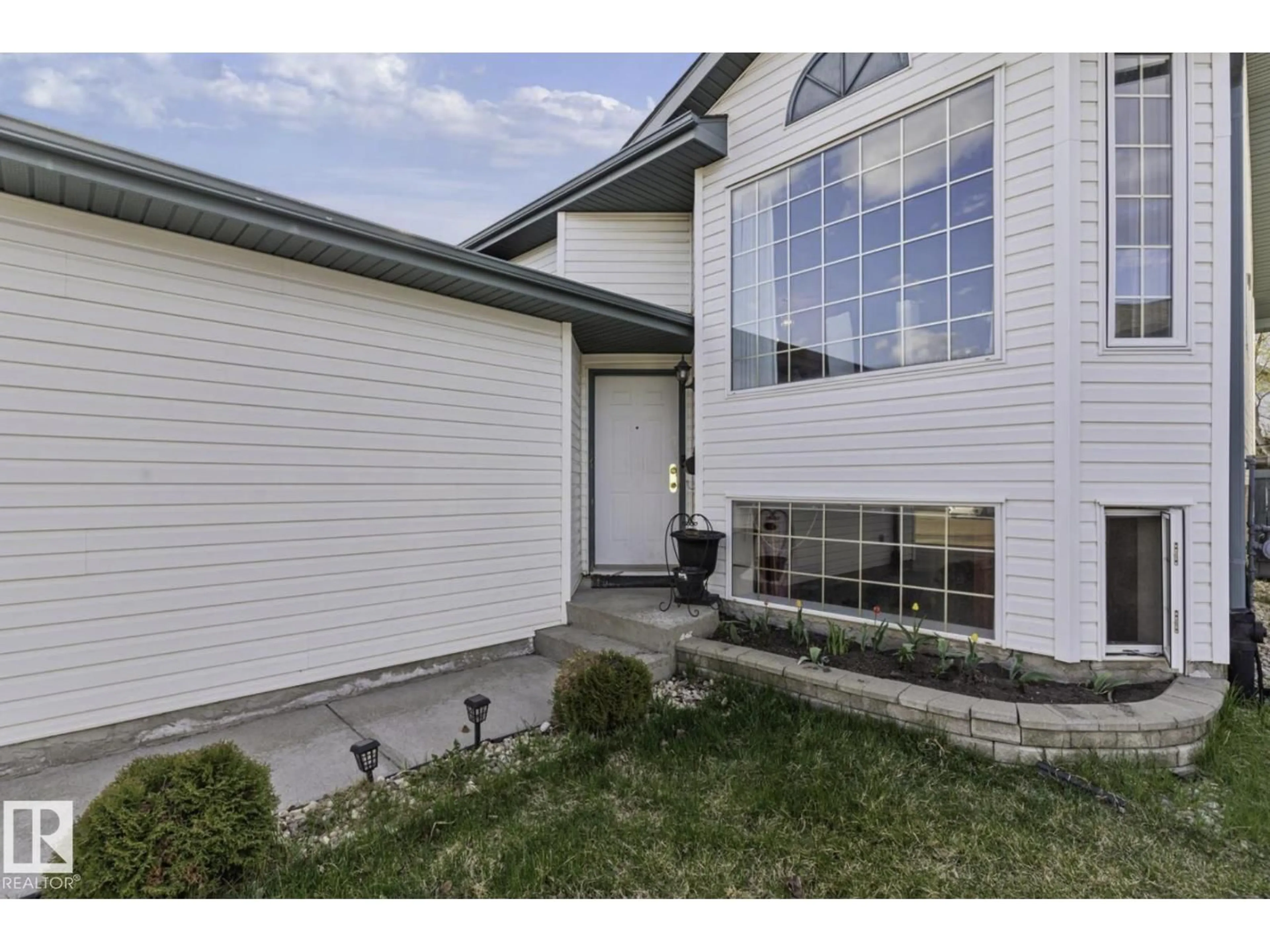 Home with vinyl exterior material, street for NW - 4030 37A AVENUE, Edmonton Alberta T6L7A1