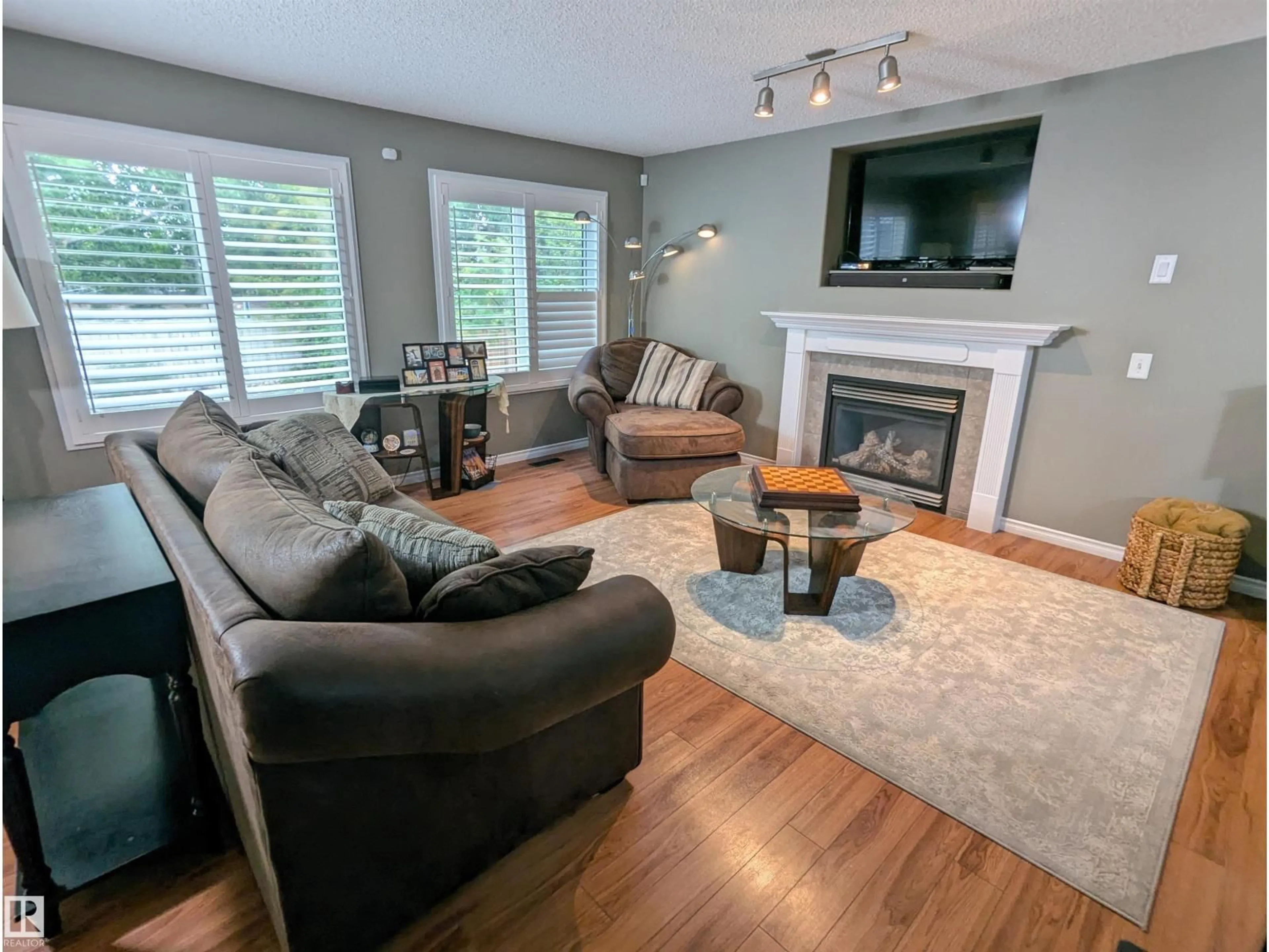 Living room with furniture, wood/laminate floor for 13 ENGLISH WY, St. Albert Alberta T8N7G6