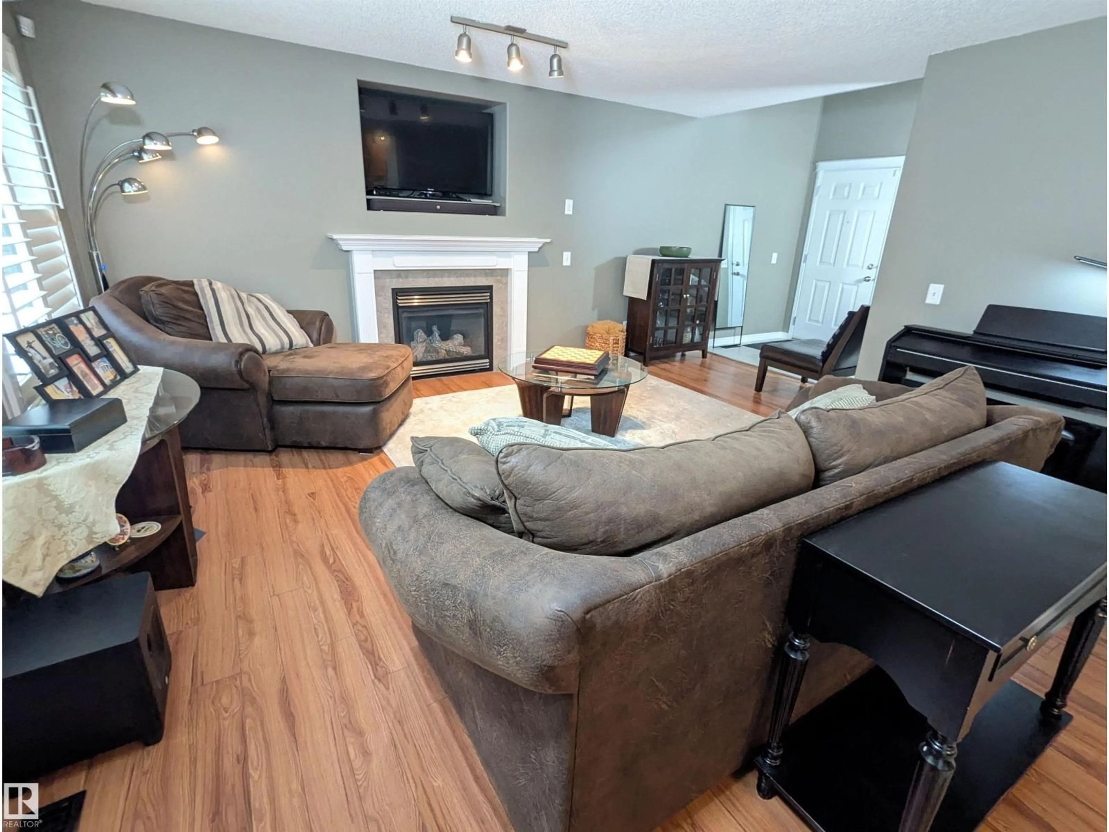 Living room with furniture, wood/laminate floor for 13 ENGLISH WY, St. Albert Alberta T8N7G6