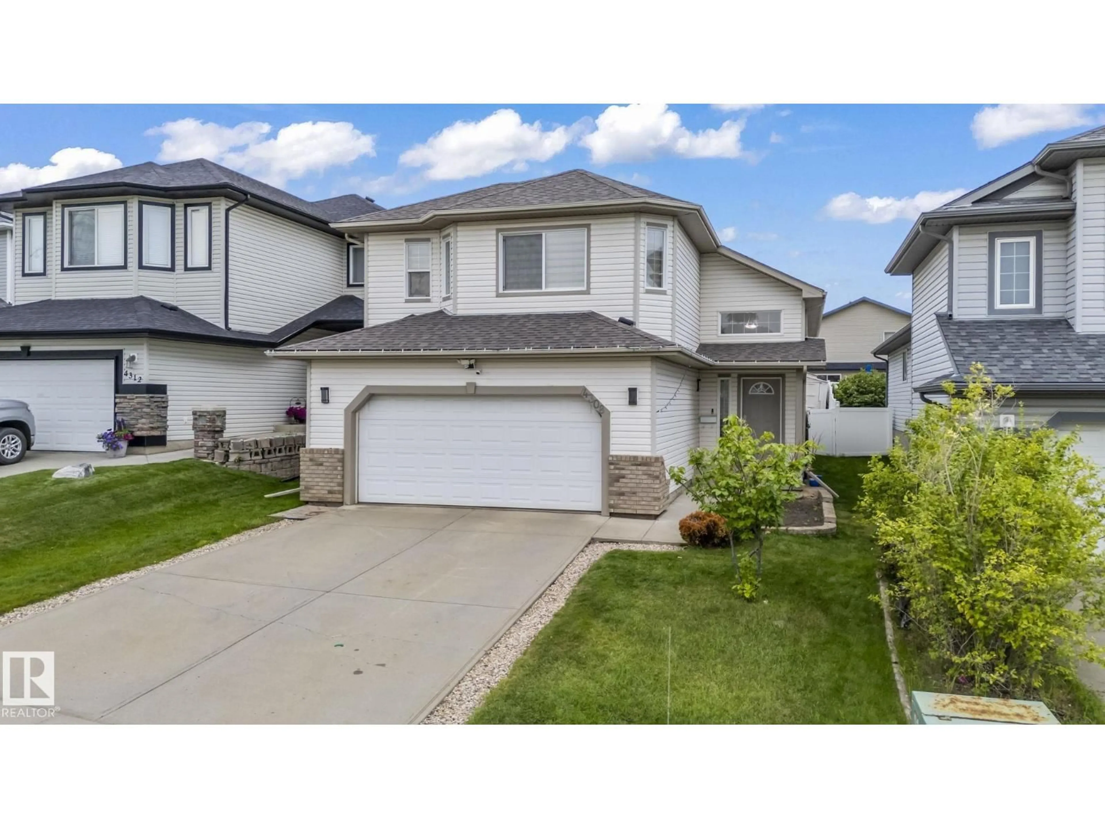 Home with vinyl exterior material, street for NW - 4308 155 AV, Edmonton Alberta T5Y3G9