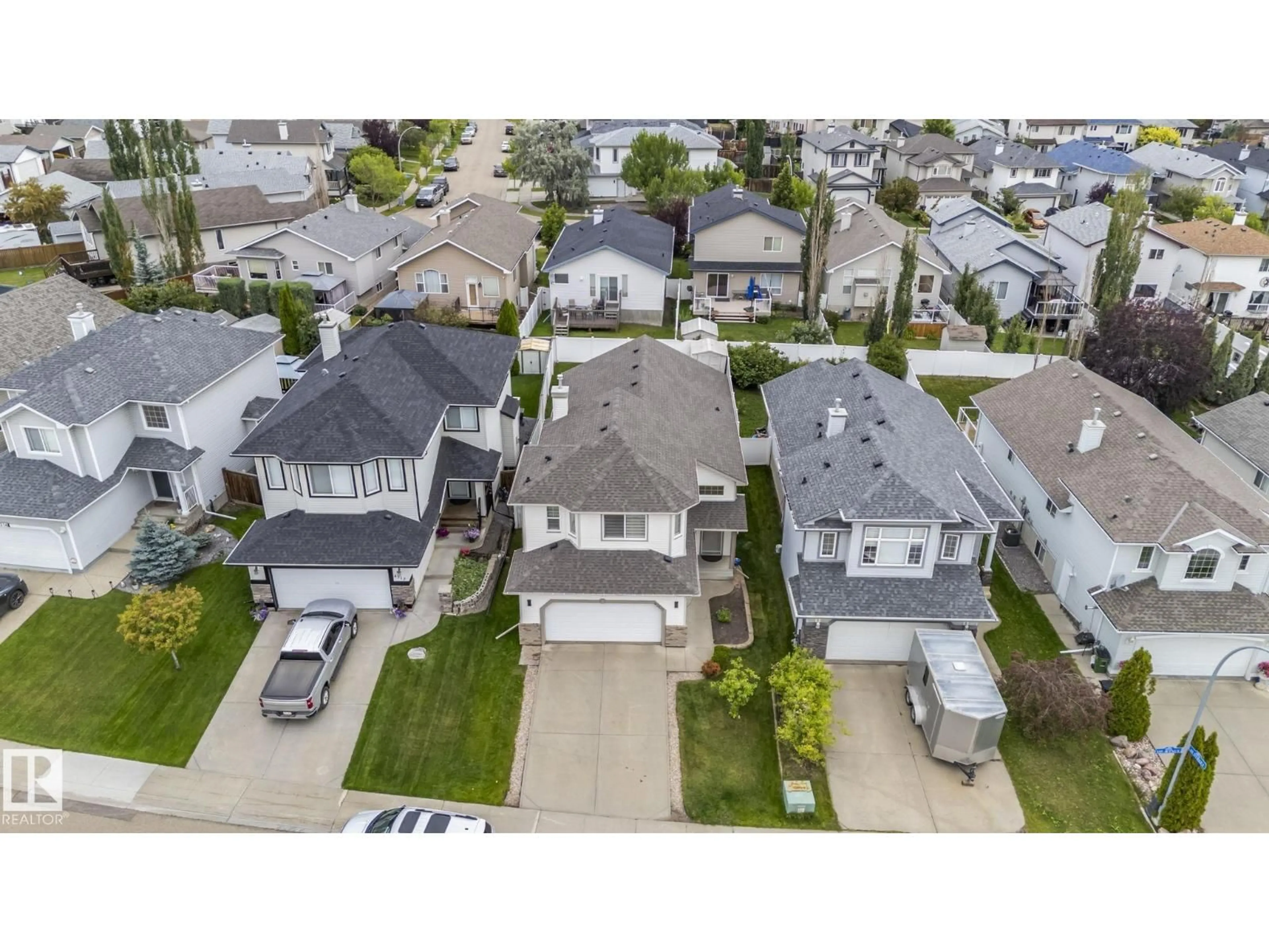 A pic from outside/outdoor area/front of a property/back of a property/a pic from drone, street for NW - 4308 155 AV, Edmonton Alberta T5Y3G9