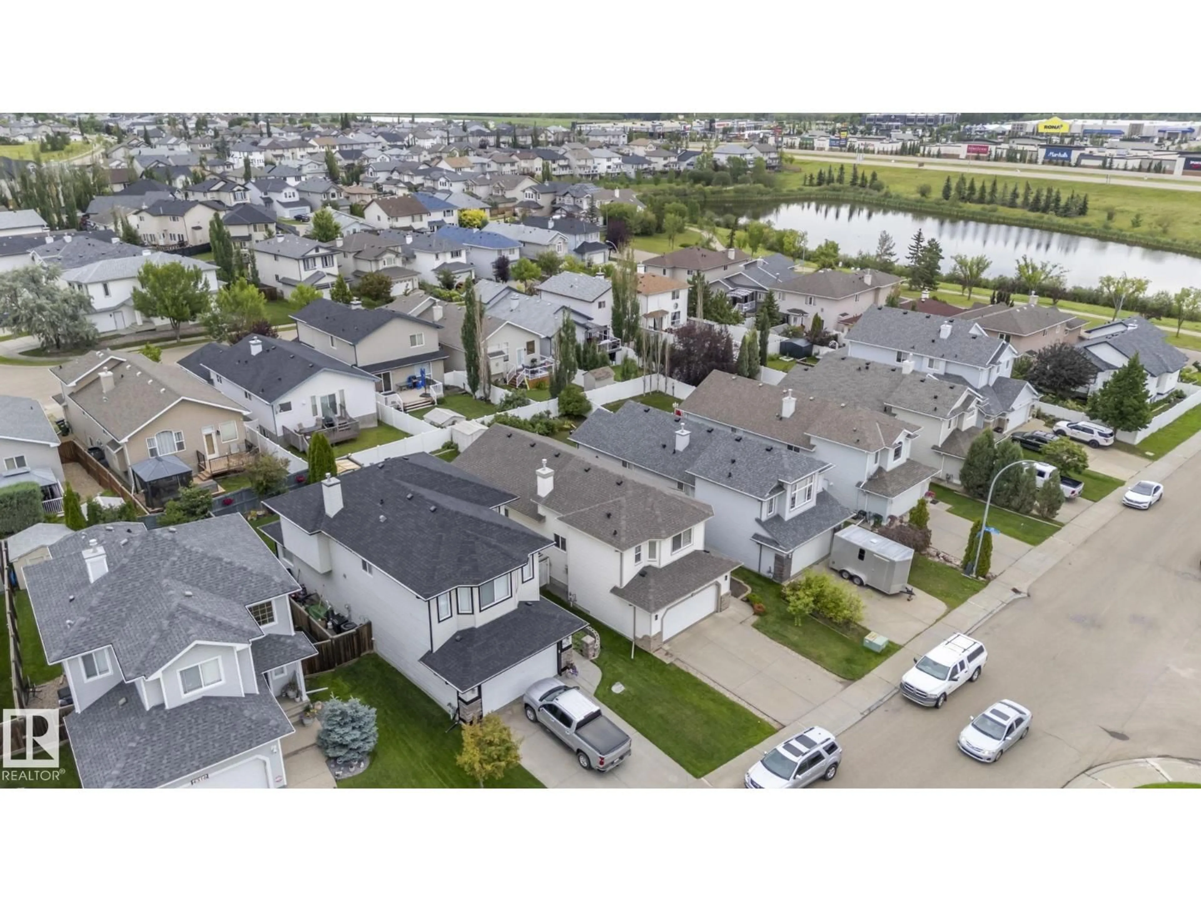 A pic from outside/outdoor area/front of a property/back of a property/a pic from drone, street for NW - 4308 155 AV, Edmonton Alberta T5Y3G9