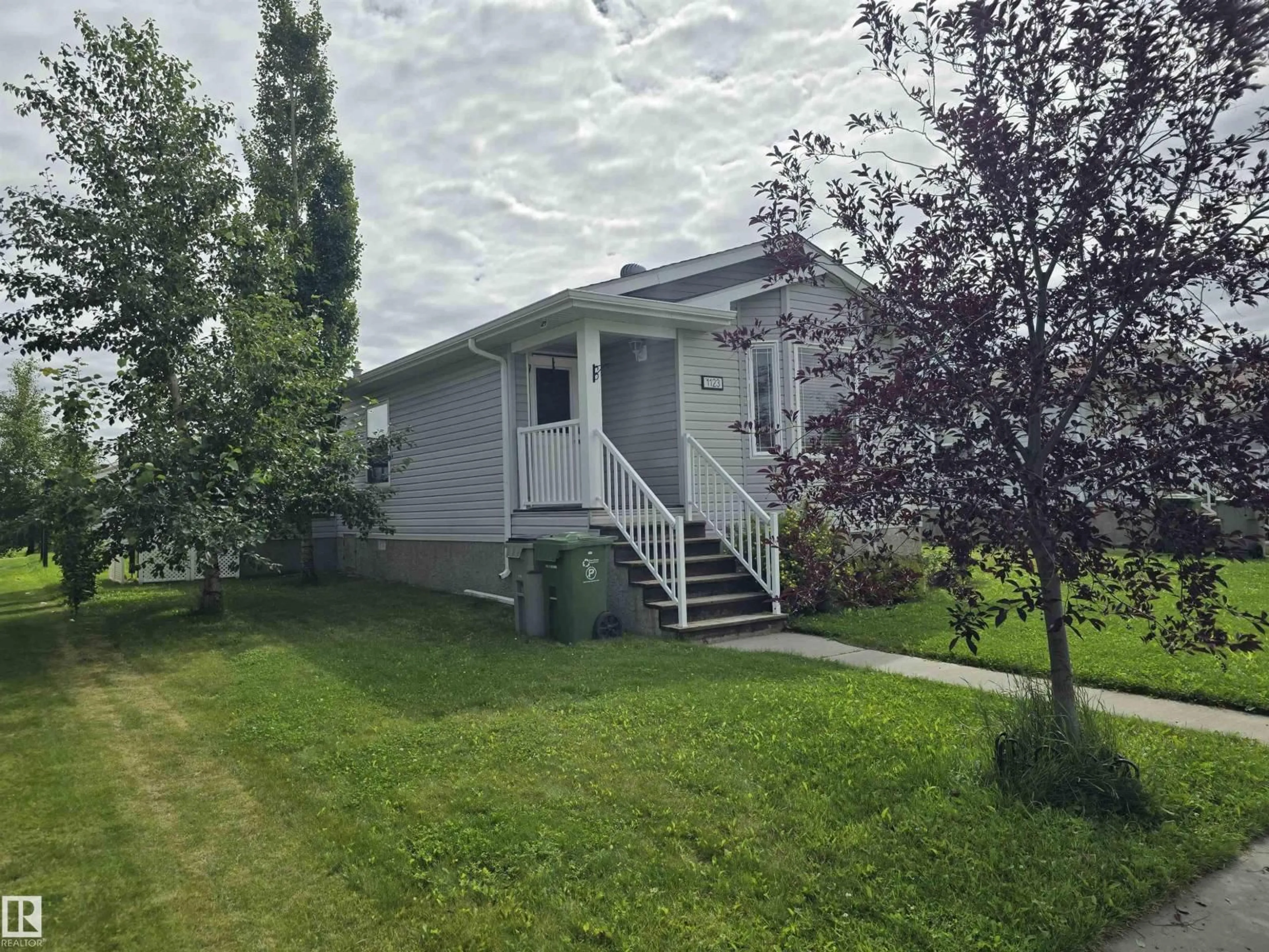Home with vinyl exterior material, street for 1123 ASPEN DR, Leduc Alberta T9E8R3