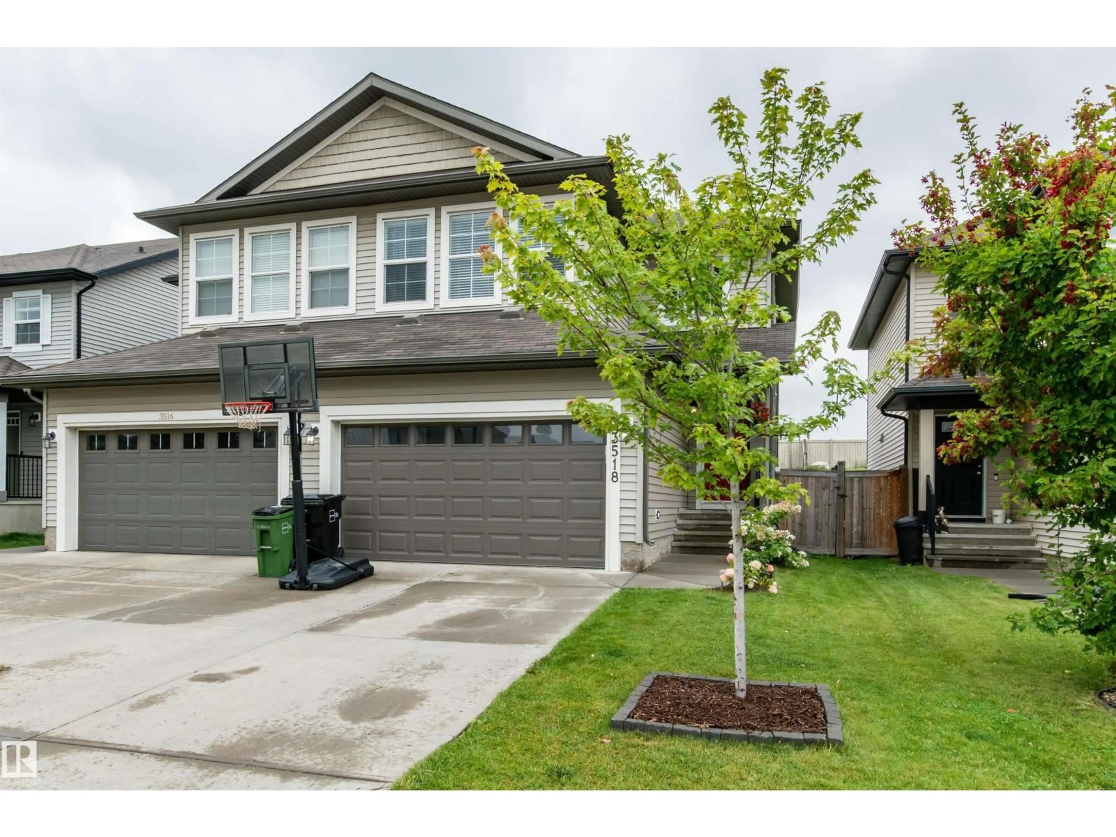 Home with vinyl exterior material, street for 3518 9 ST, Edmonton Alberta T6T0S5