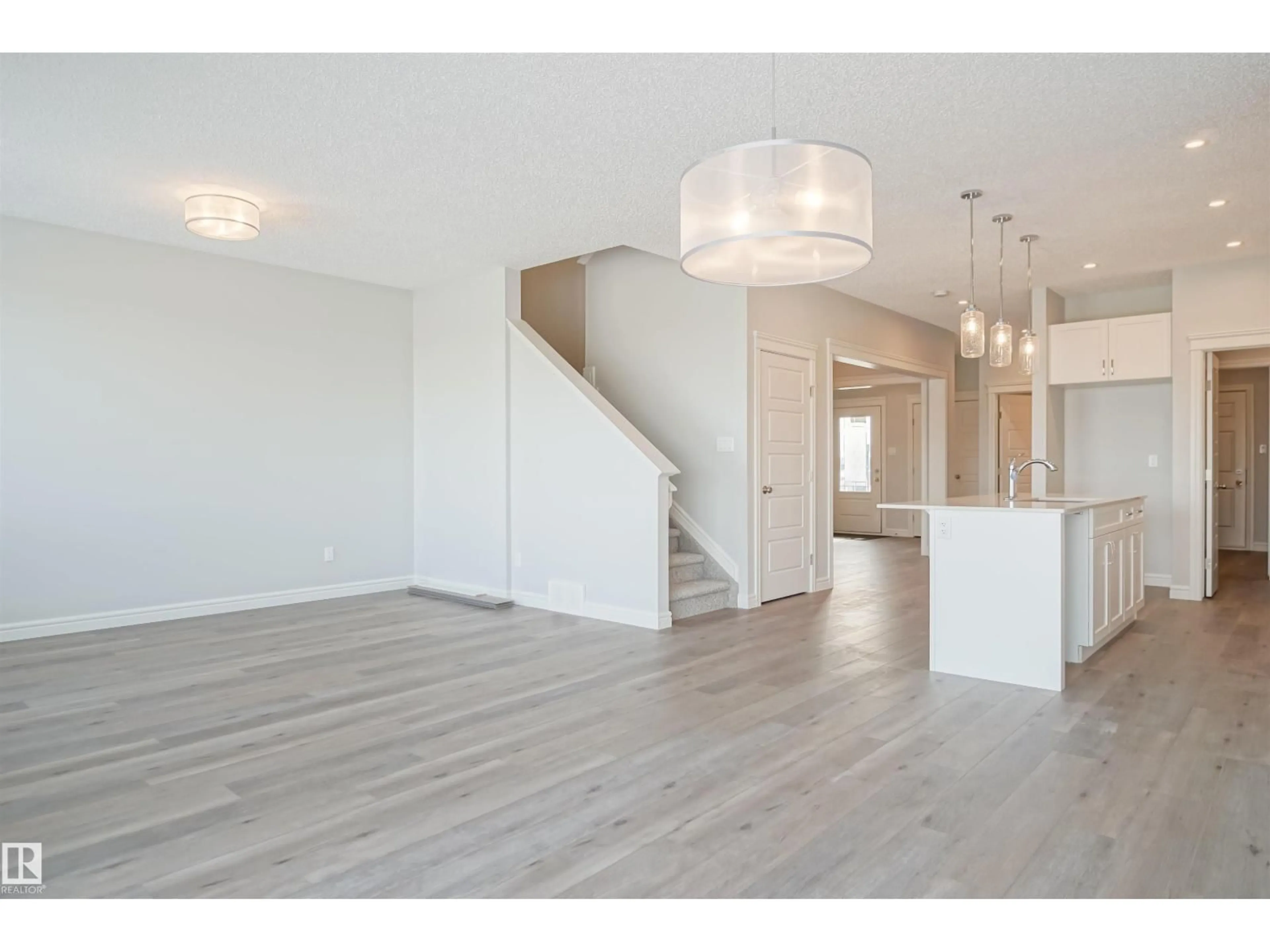 Open concept kitchen, wood/laminate floor for NE - 16531 3 ST, Edmonton Alberta T5Y4E9