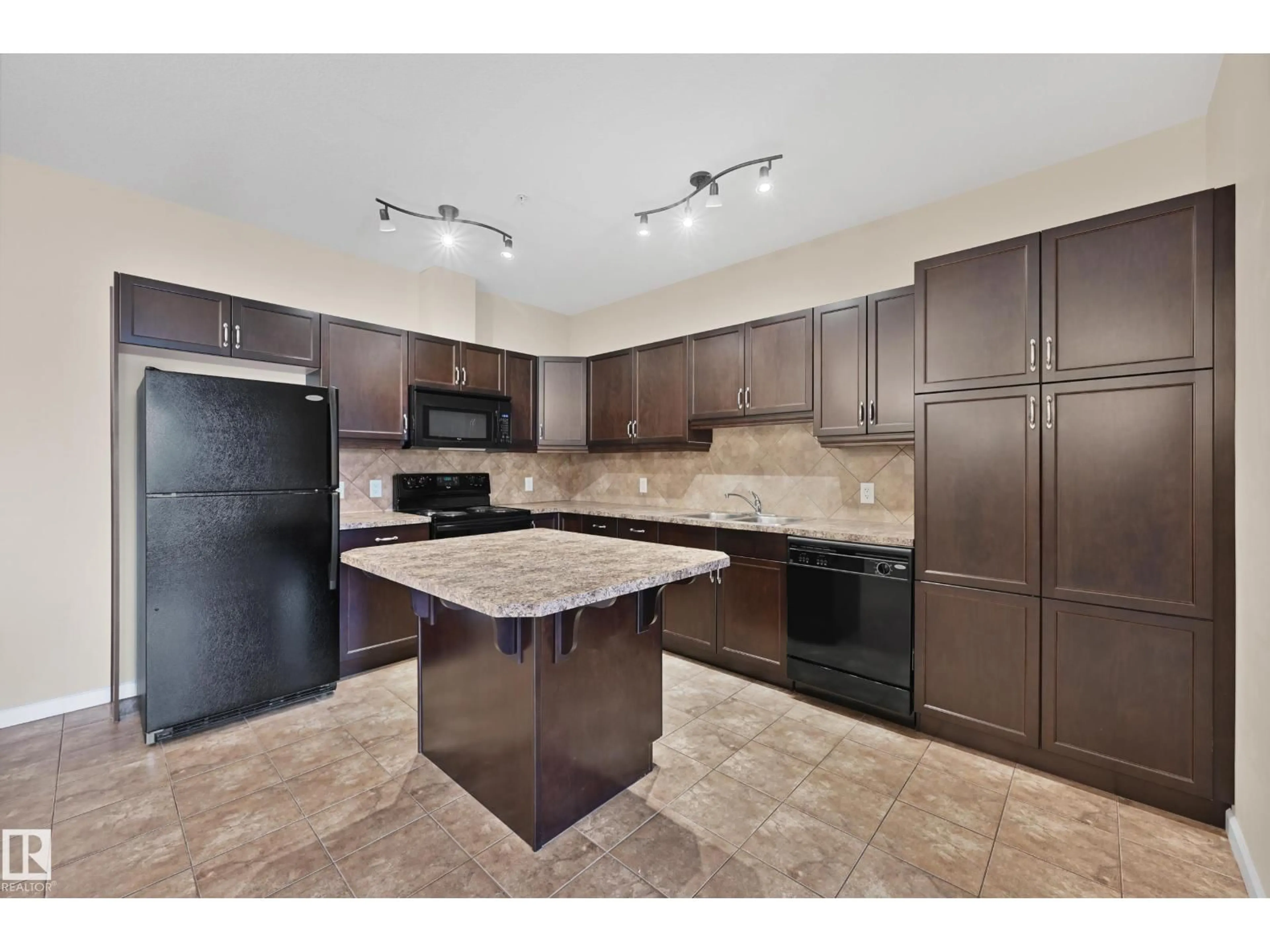 Open concept kitchen, ceramic/tile floor for #216 - 6083 MAYNARD WY, Edmonton Alberta T6R0S5