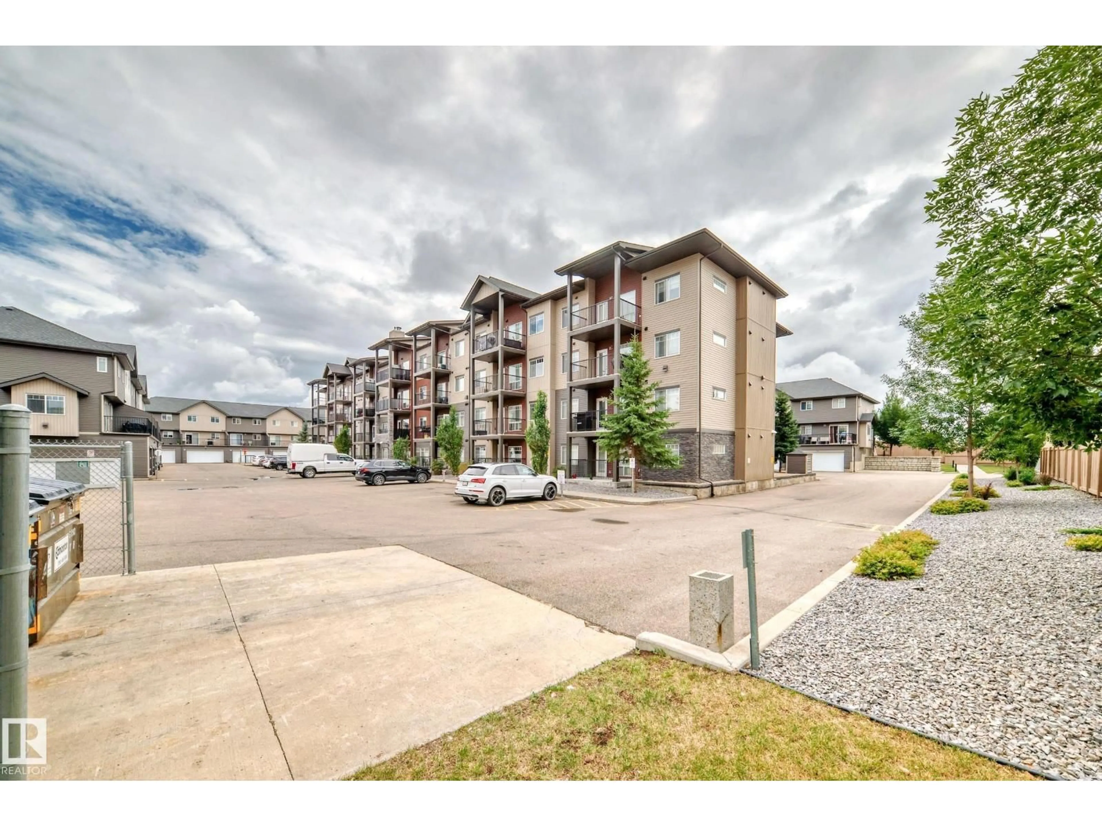 A pic from outside/outdoor area/front of a property/back of a property/a pic from drone, mountain view for #303 - 9517 160 AV, Edmonton Alberta T5Z0N1