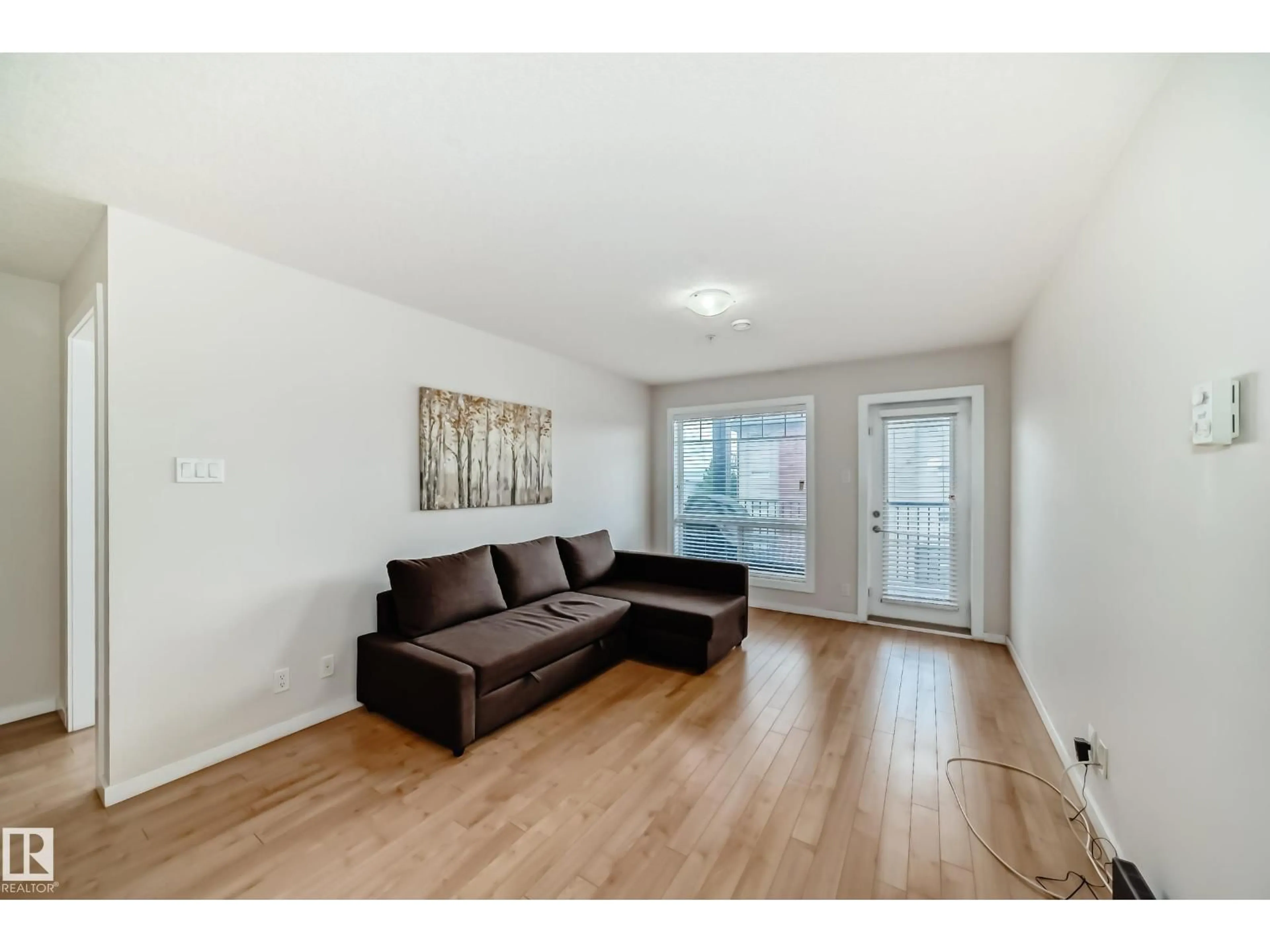 Living room with furniture, wood/laminate floor for #303 - 9517 160 AV, Edmonton Alberta T5Z0N1