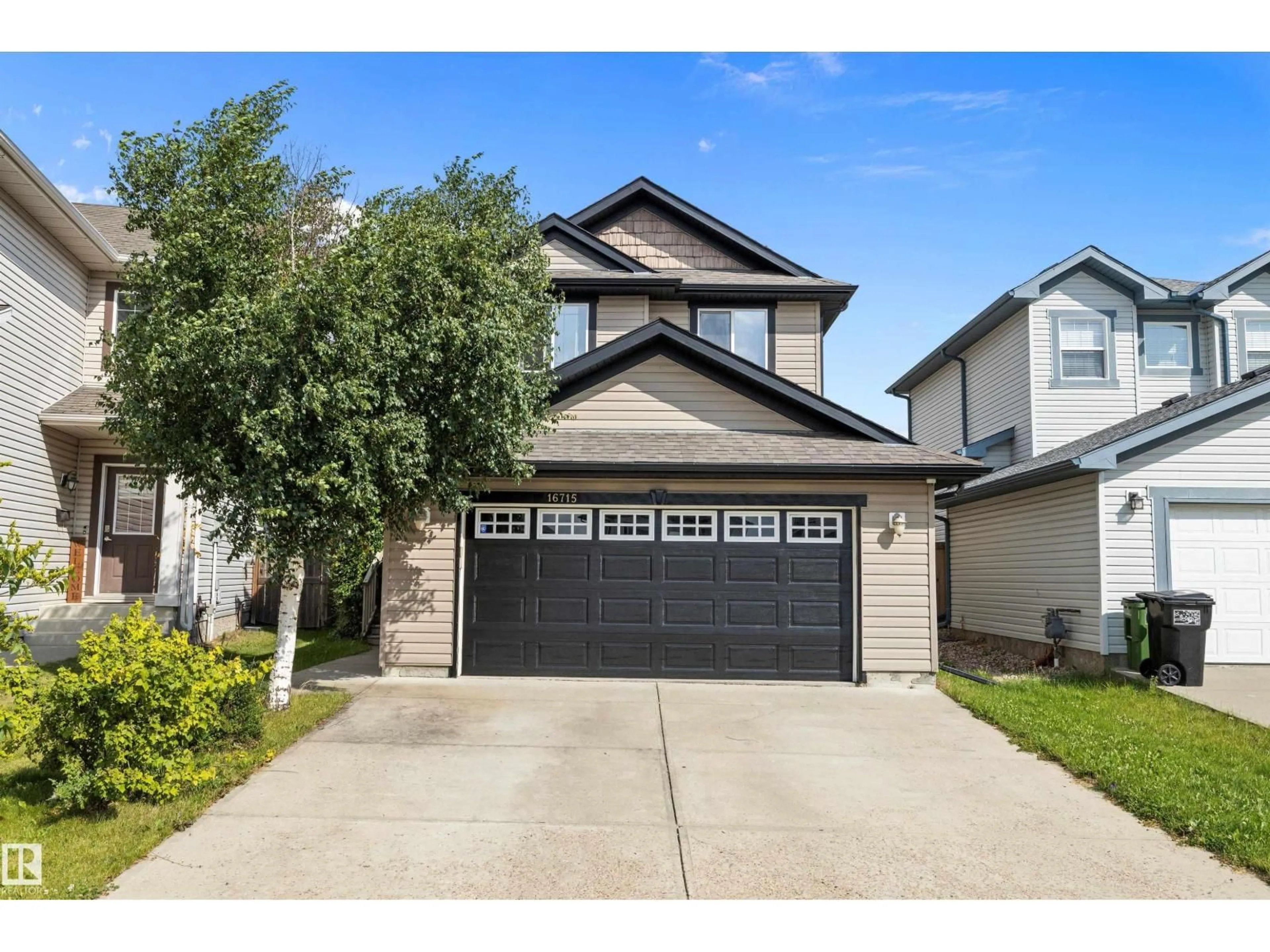 Home with vinyl exterior material, street for NW - 16715 114 ST, Edmonton Alberta T5X0A7