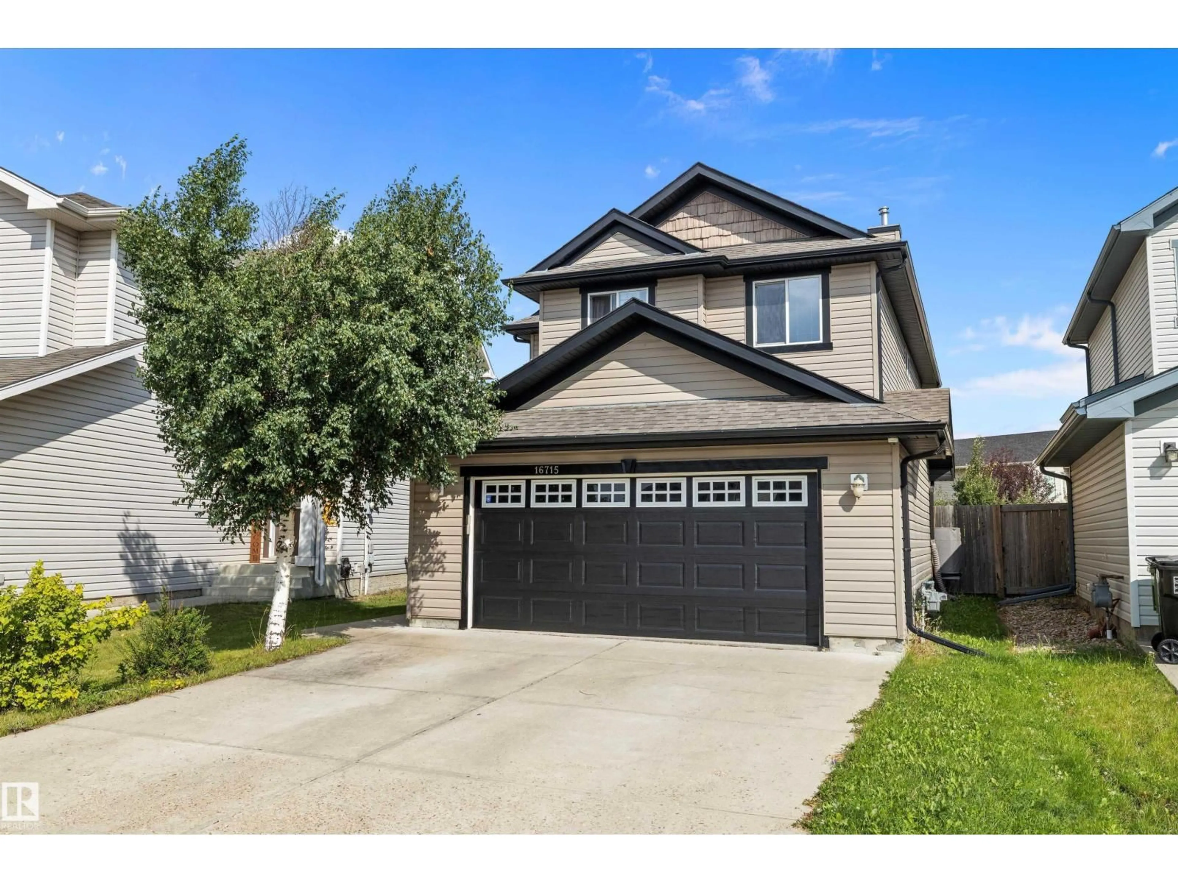 Home with vinyl exterior material, street for NW - 16715 114 ST, Edmonton Alberta T5X0A7