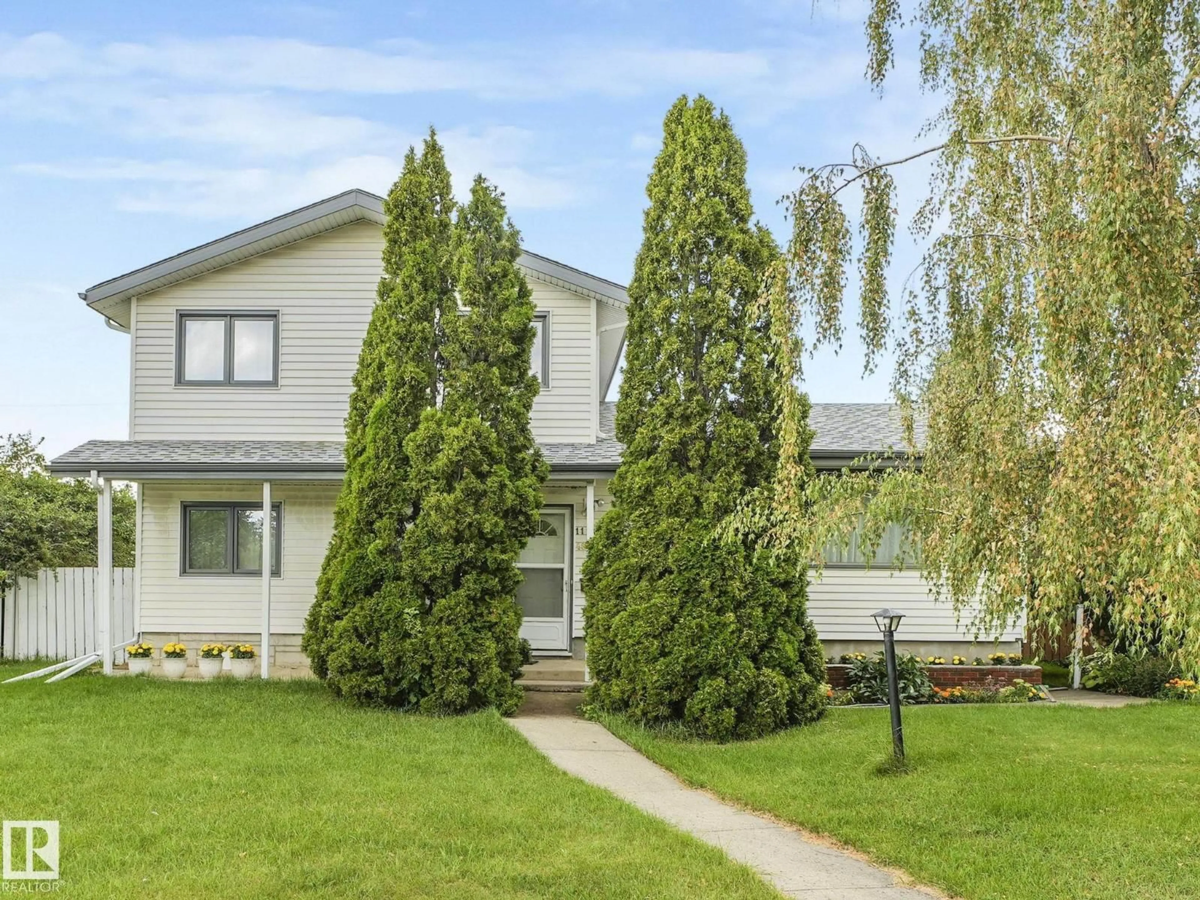 Home with vinyl exterior material, street for 11204 48 AV NW, Edmonton Alberta T6H0C7