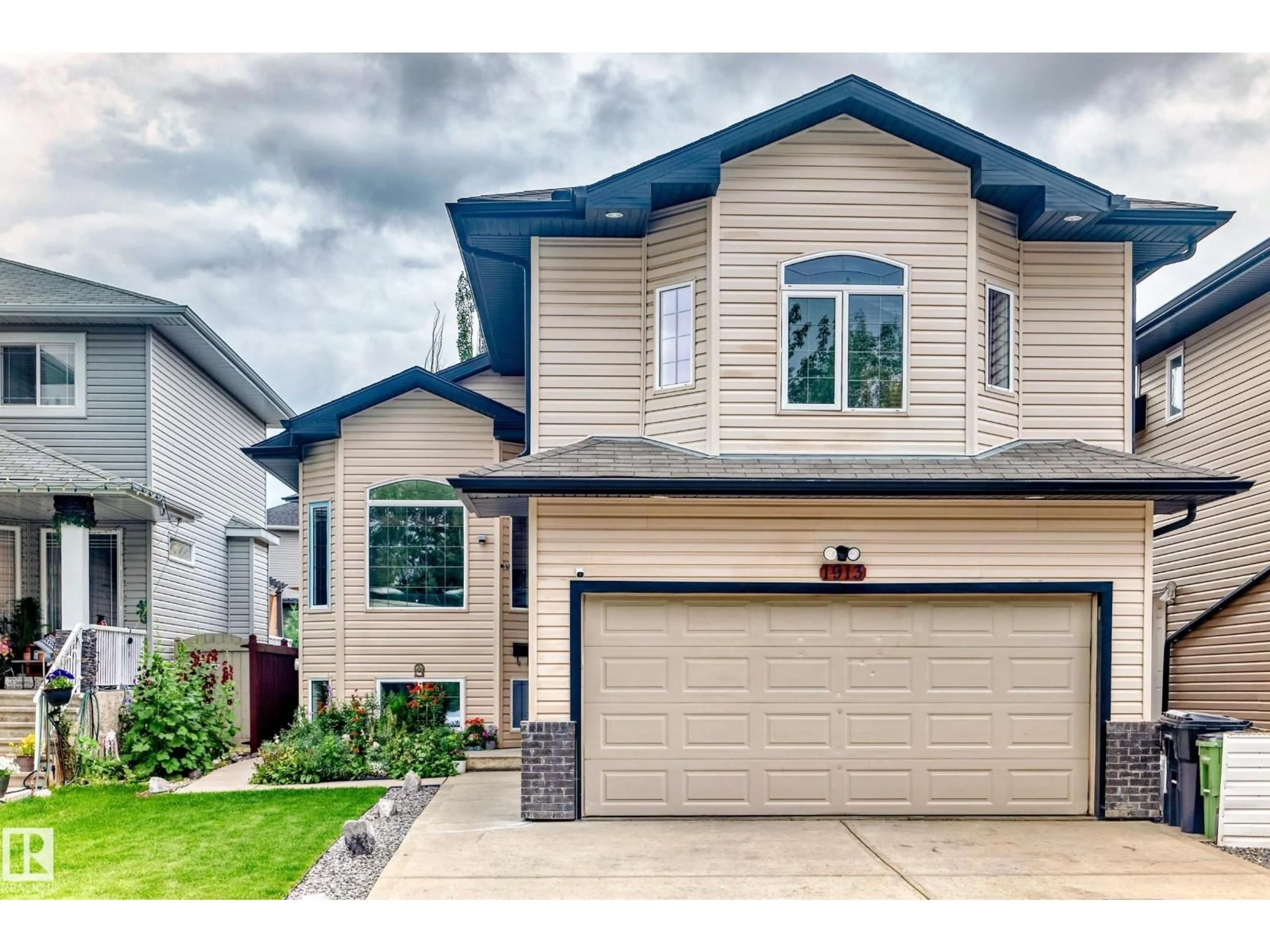 Home with vinyl exterior material, street for 1913 33B AV, Edmonton Alberta T6T0H4