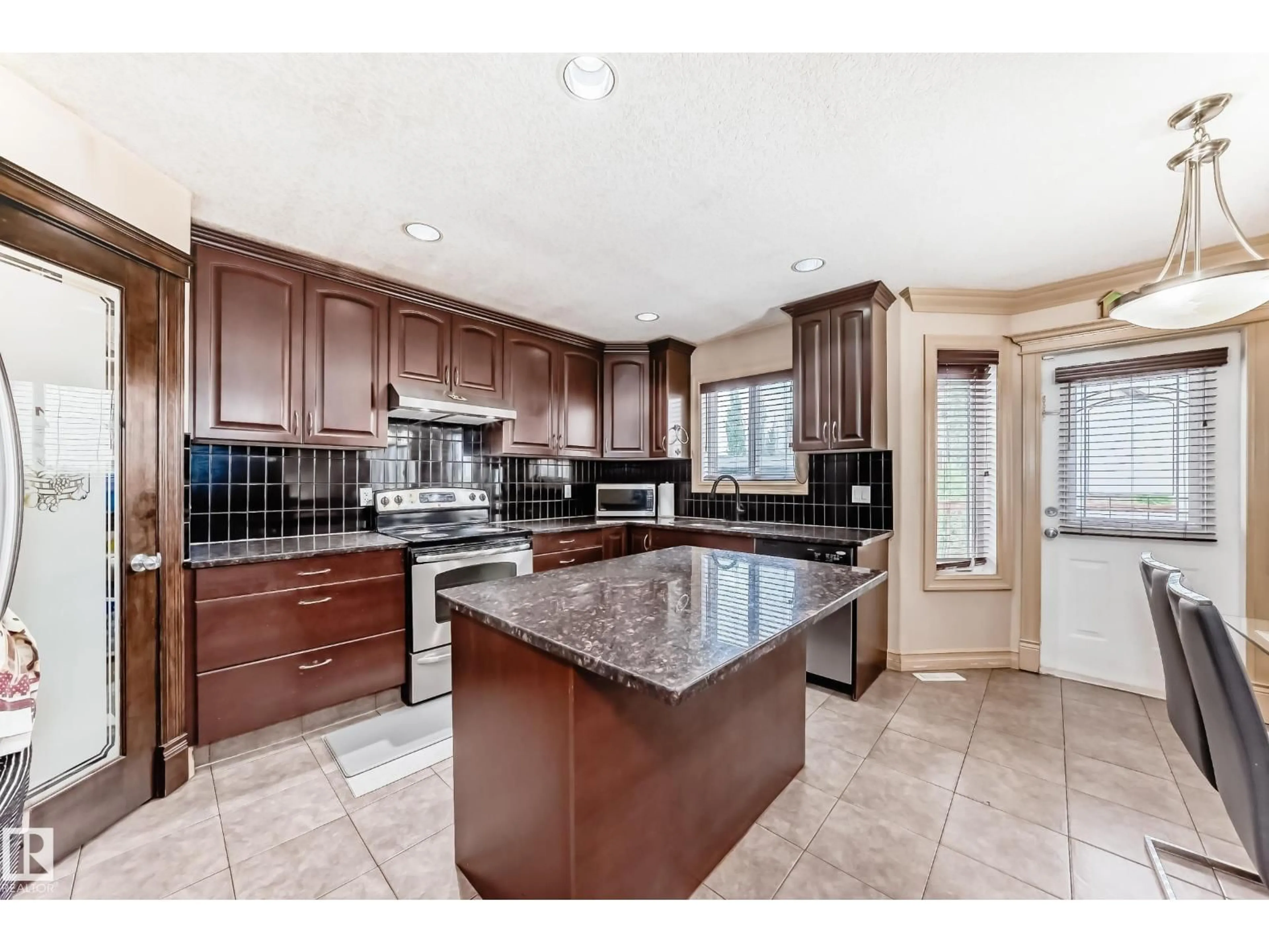 Open concept kitchen, ceramic/tile floor for 1913 33B AV, Edmonton Alberta T6T0H4