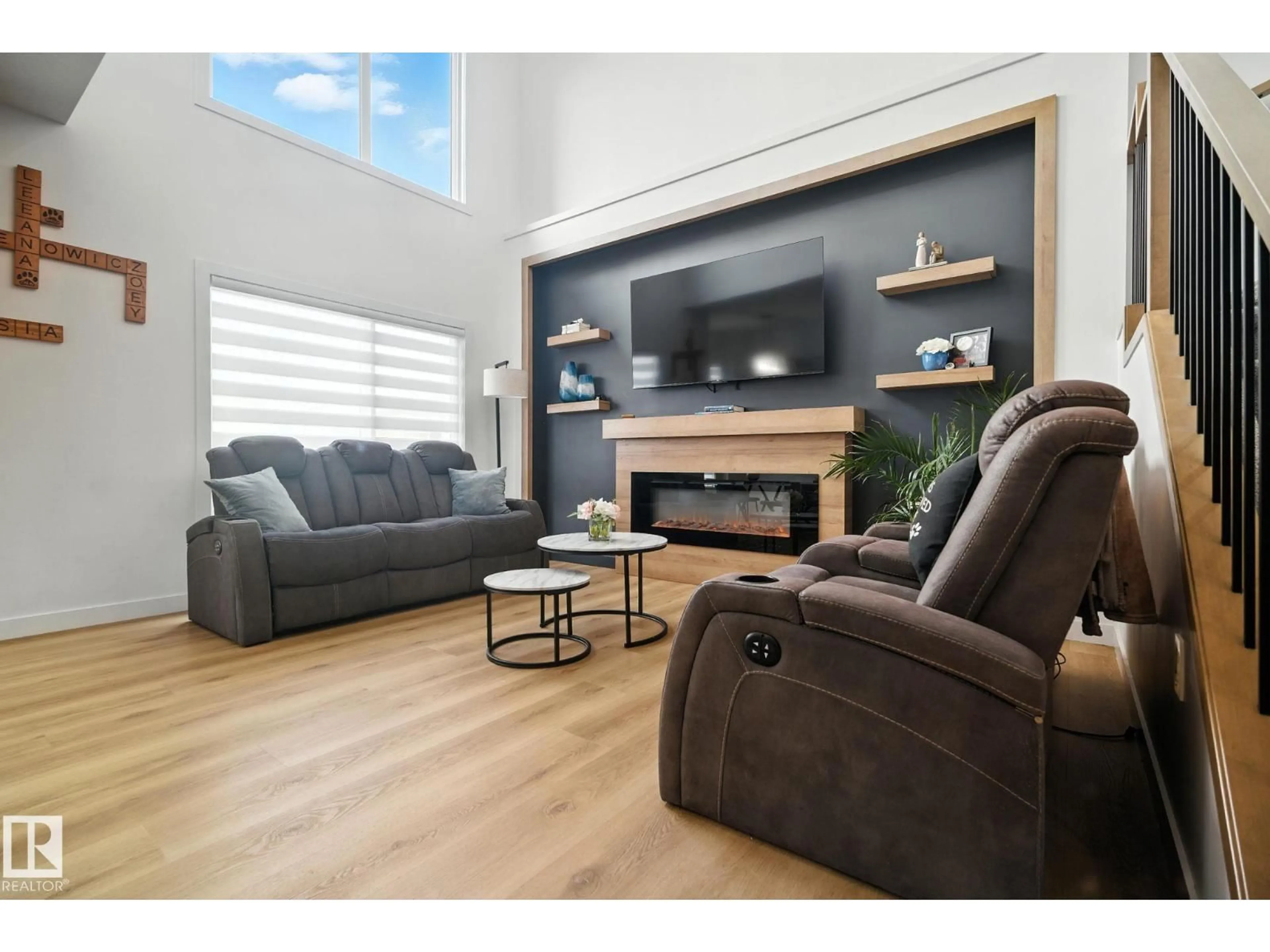 Living room with furniture, wood/laminate floor for 50 GRASSVIEW CR, Spruce Grove Alberta T7X3G1