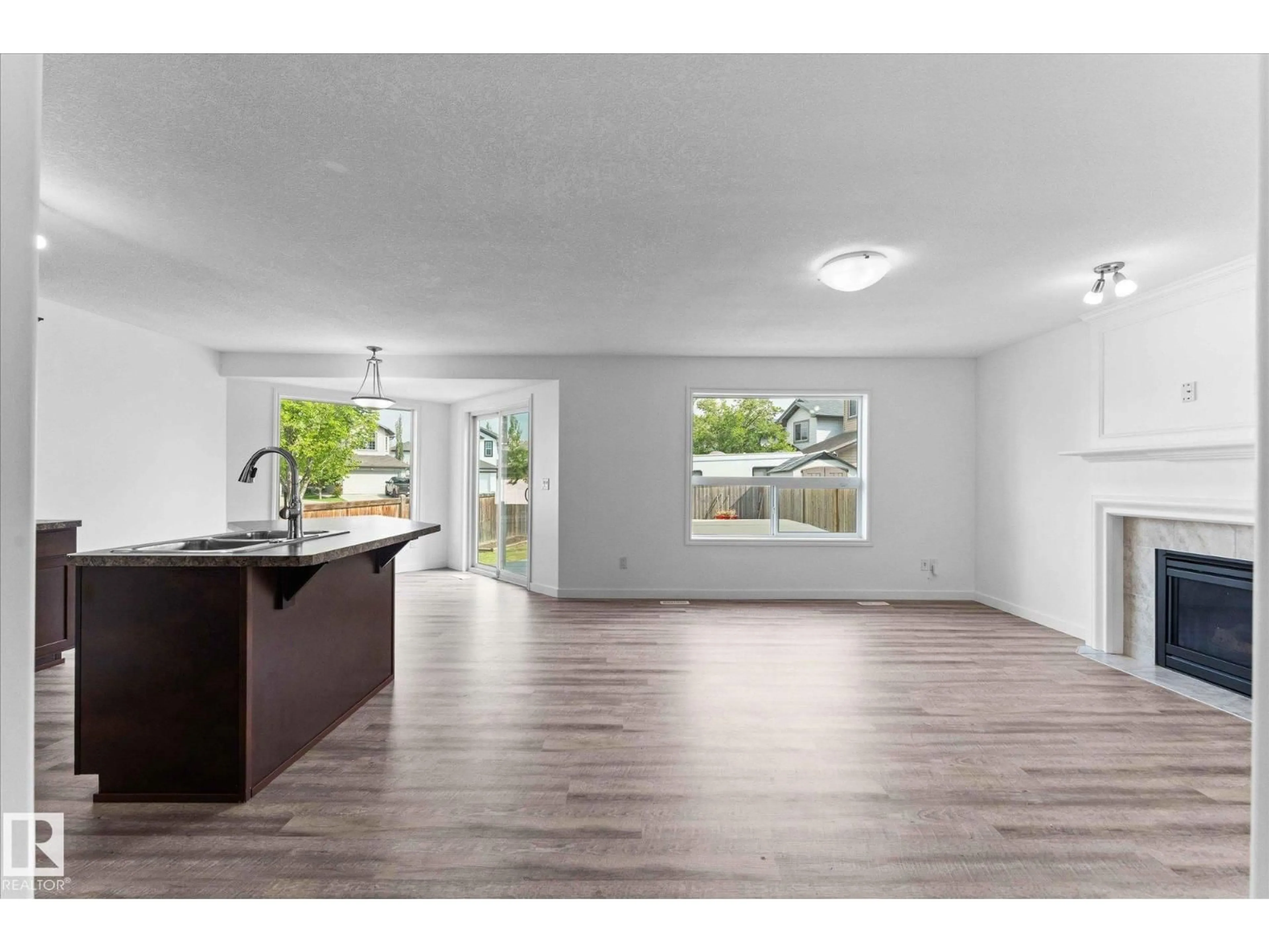 Open concept kitchen, wood/laminate floor for 1 RIDGELAND WY, Fort Saskatchewan Alberta T8L0E7