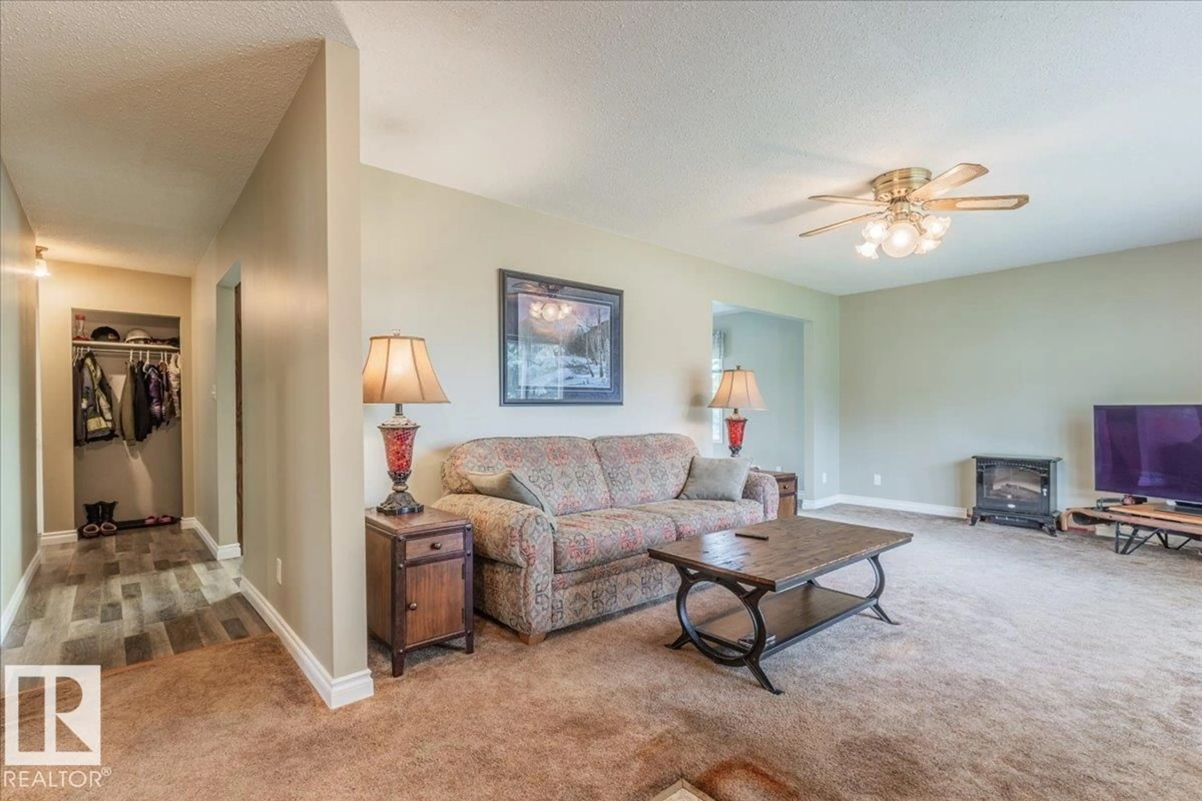 Living room with furniture, carpet floor for 460077 RGE ROAD 253, Rural Wetaskiwin County Alberta T9A1X2