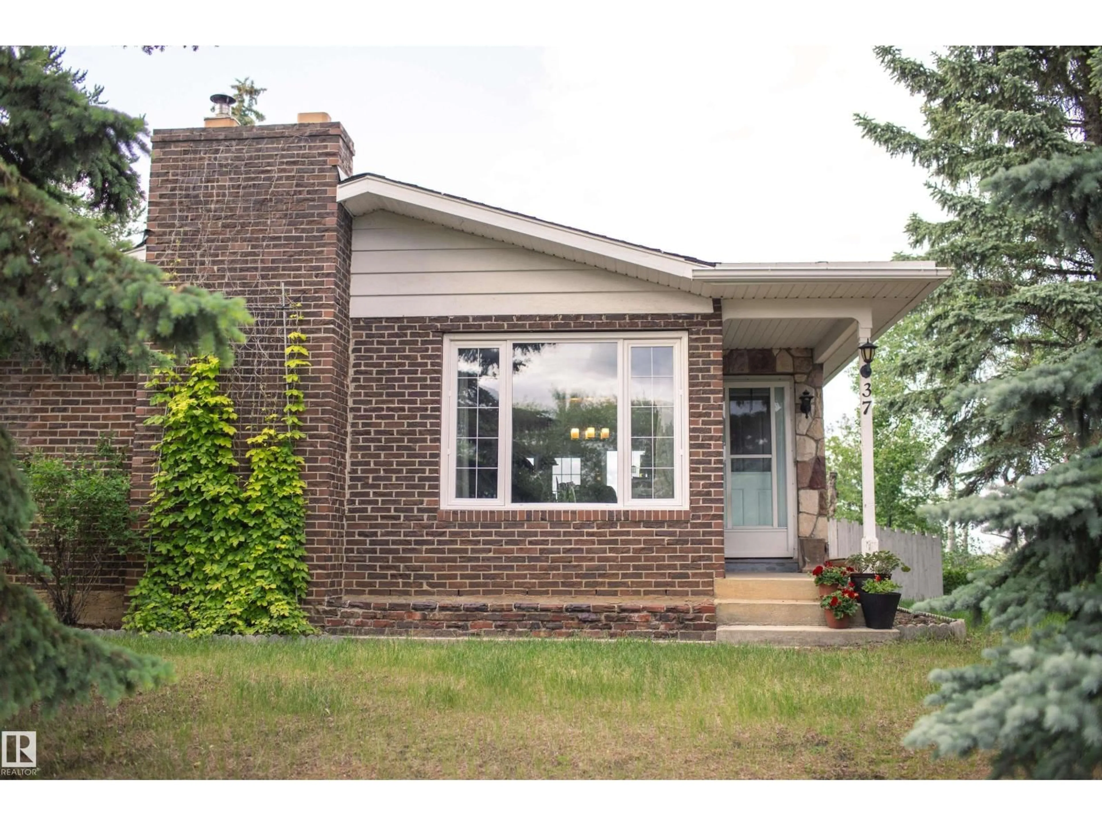 Home with brick exterior material, street for 37 - 55305 RGE ROAD 242, Rural Sturgeon County Alberta T8T1Y1