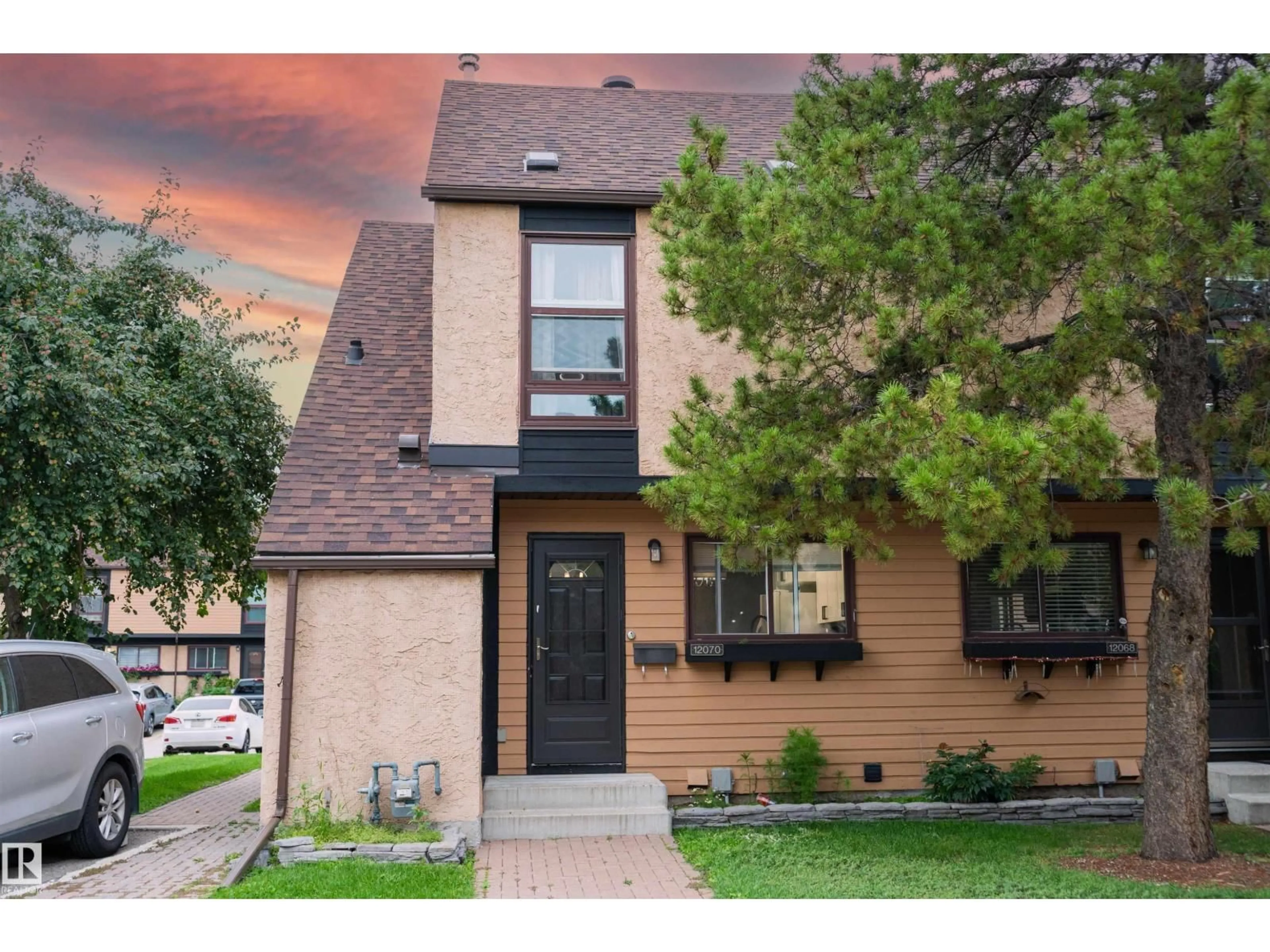 Home with brick exterior material, street for 12070 25 AV, Edmonton Alberta T6J4L3