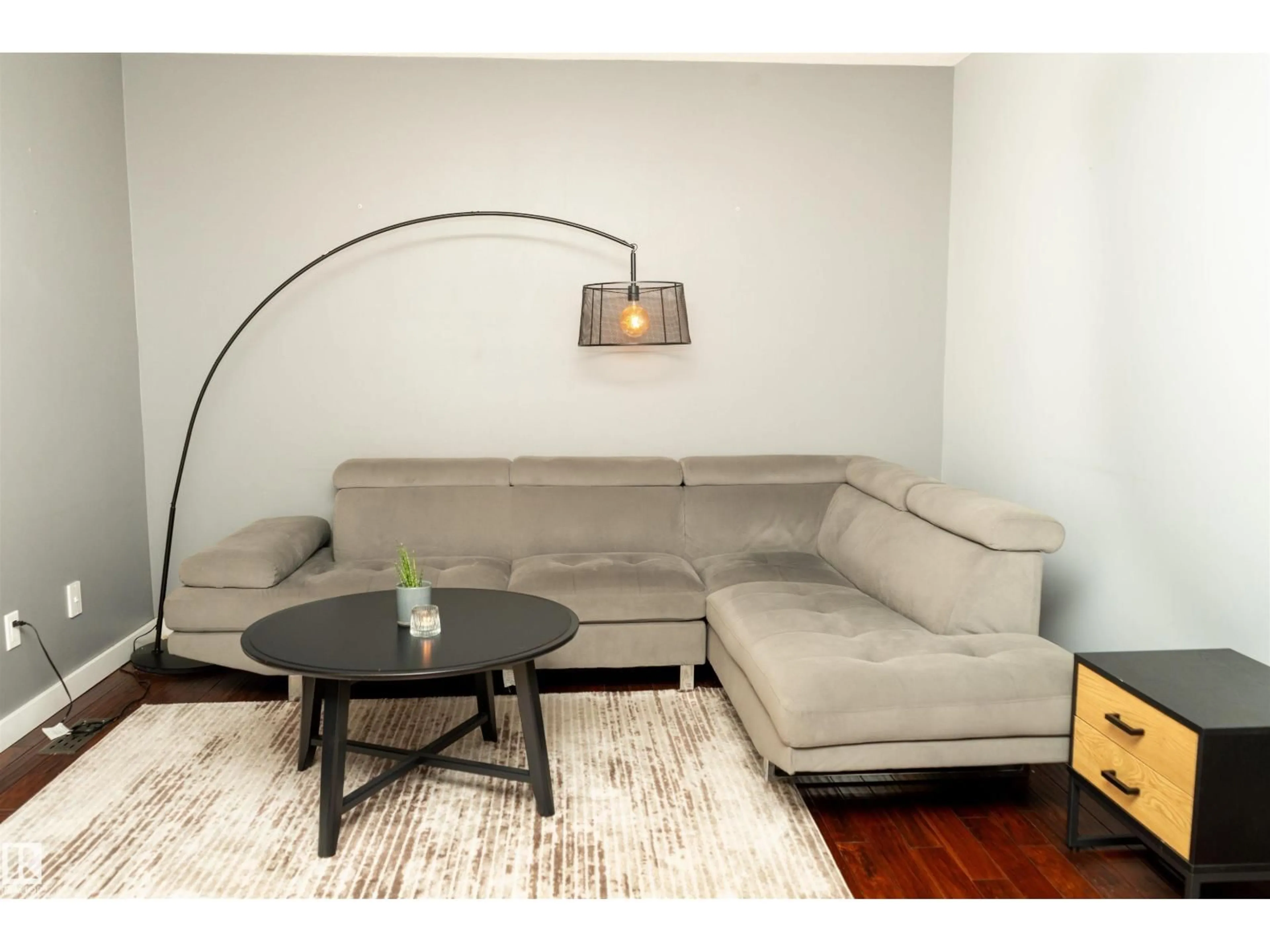 Living room with furniture, wood/laminate floor for 12070 25 AV, Edmonton Alberta T6J4L3