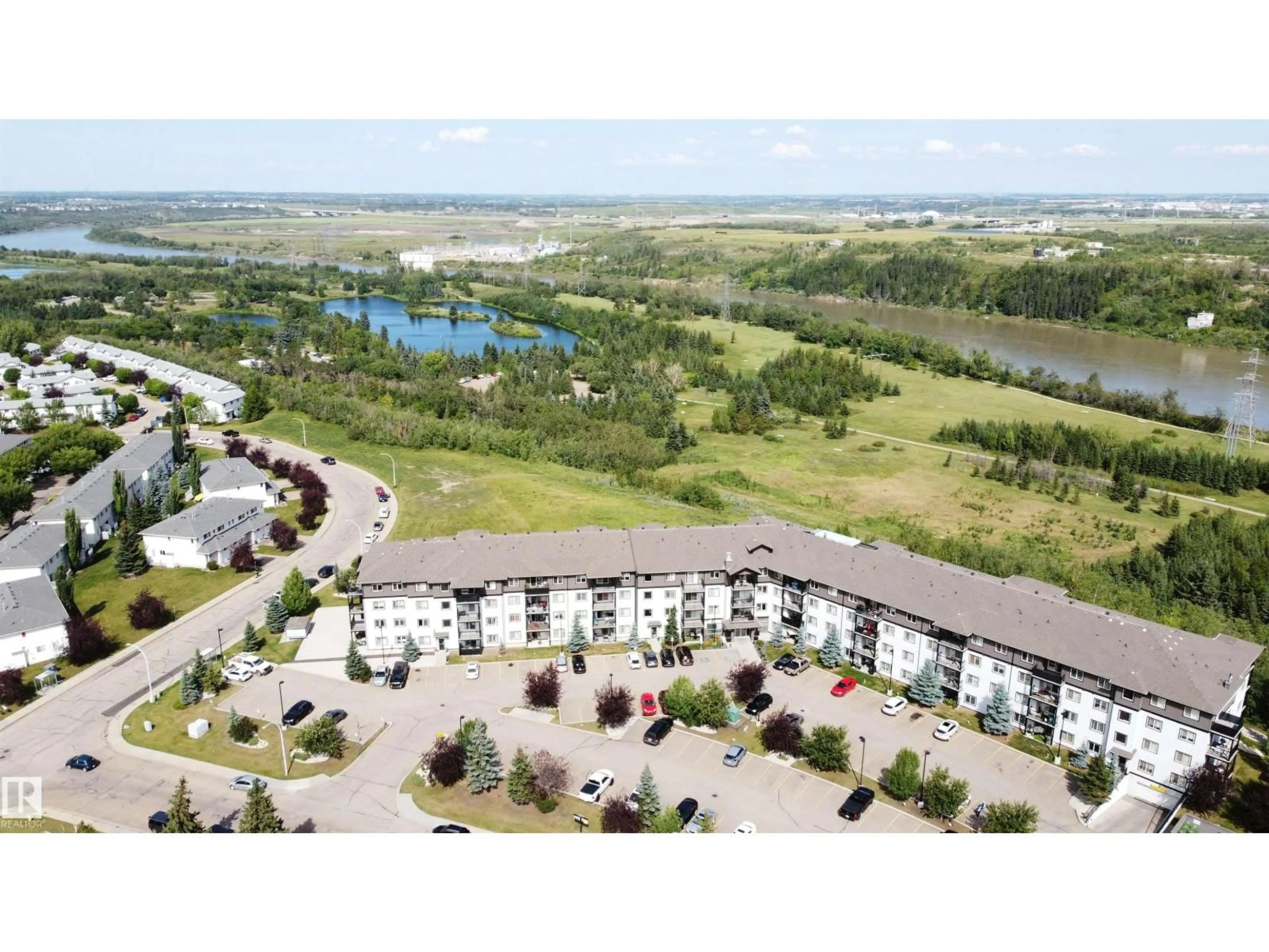 A pic from outside/outdoor area/front of a property/back of a property/a pic from drone, water/lake/river/ocean view for #256 - 1196 HYNDMAN RD, Edmonton Alberta T5A0X8