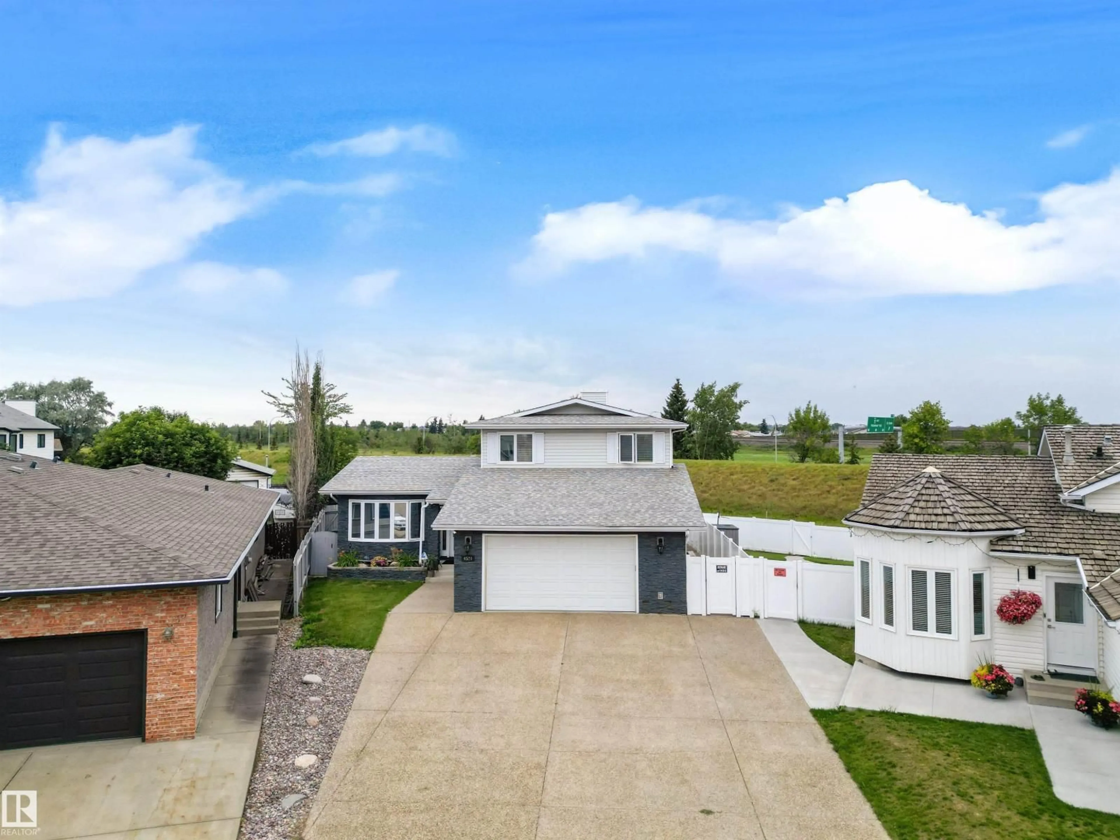 A pic from outside/outdoor area/front of a property/back of a property/a pic from drone, street for 4520 124 AV, Edmonton Alberta T5W5B8