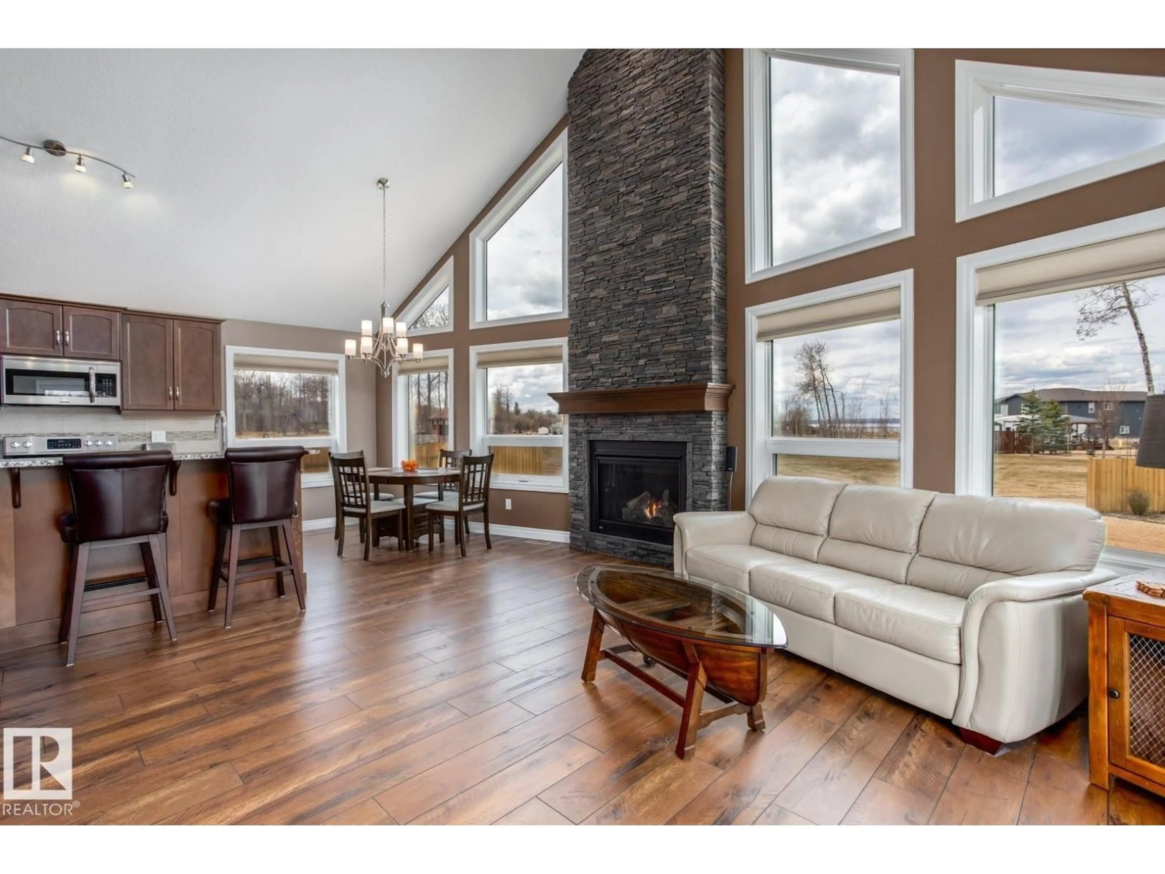 Living room with furniture, wood/laminate floor for 162 - 219 PEACE RIVER AVE, Rural Big Lakes M.D. Alberta T0G1J0