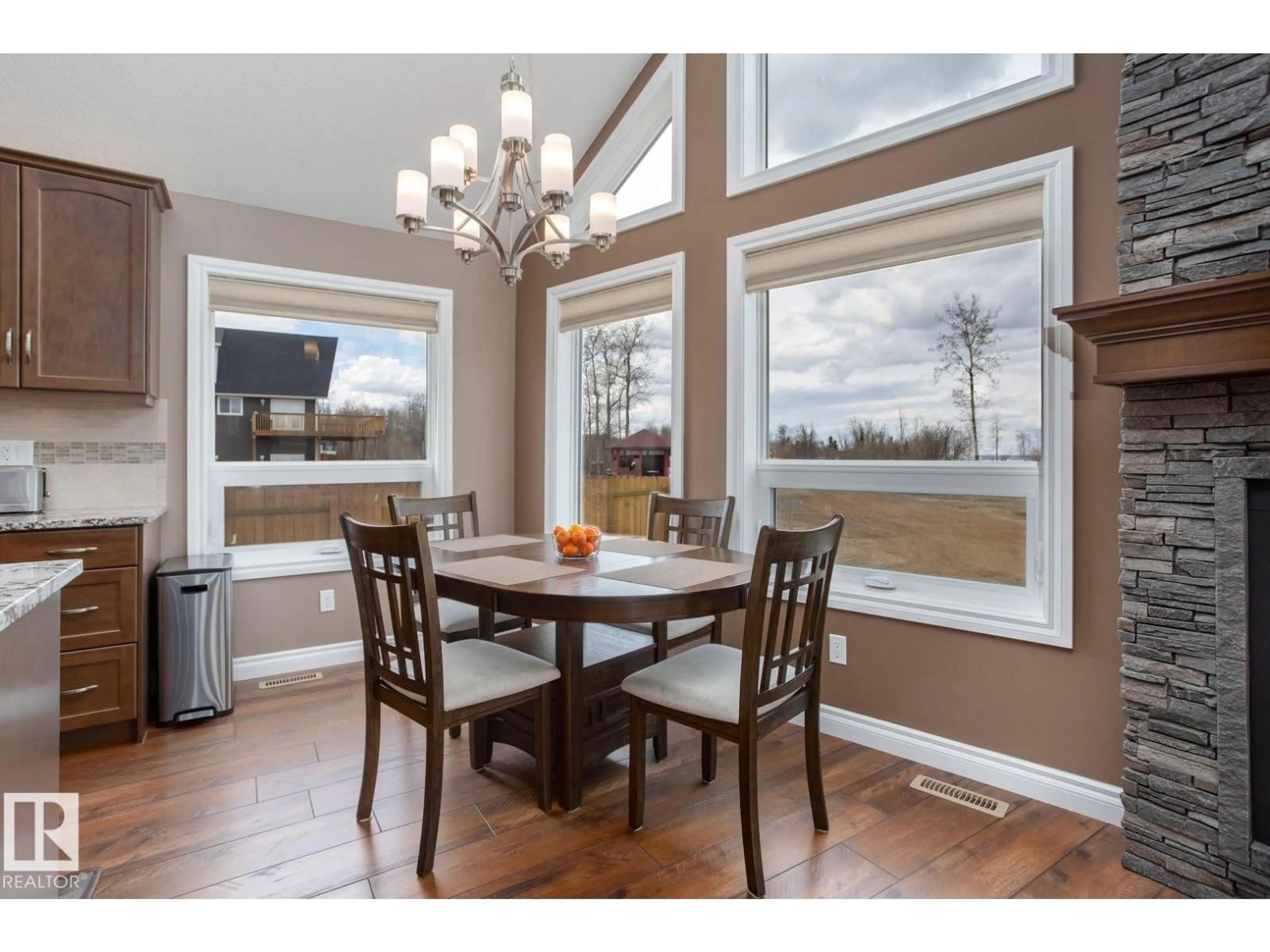 Dining room, wood/laminate floor for 162 - 219 PEACE RIVER AVE, Rural Big Lakes M.D. Alberta T0G1J0
