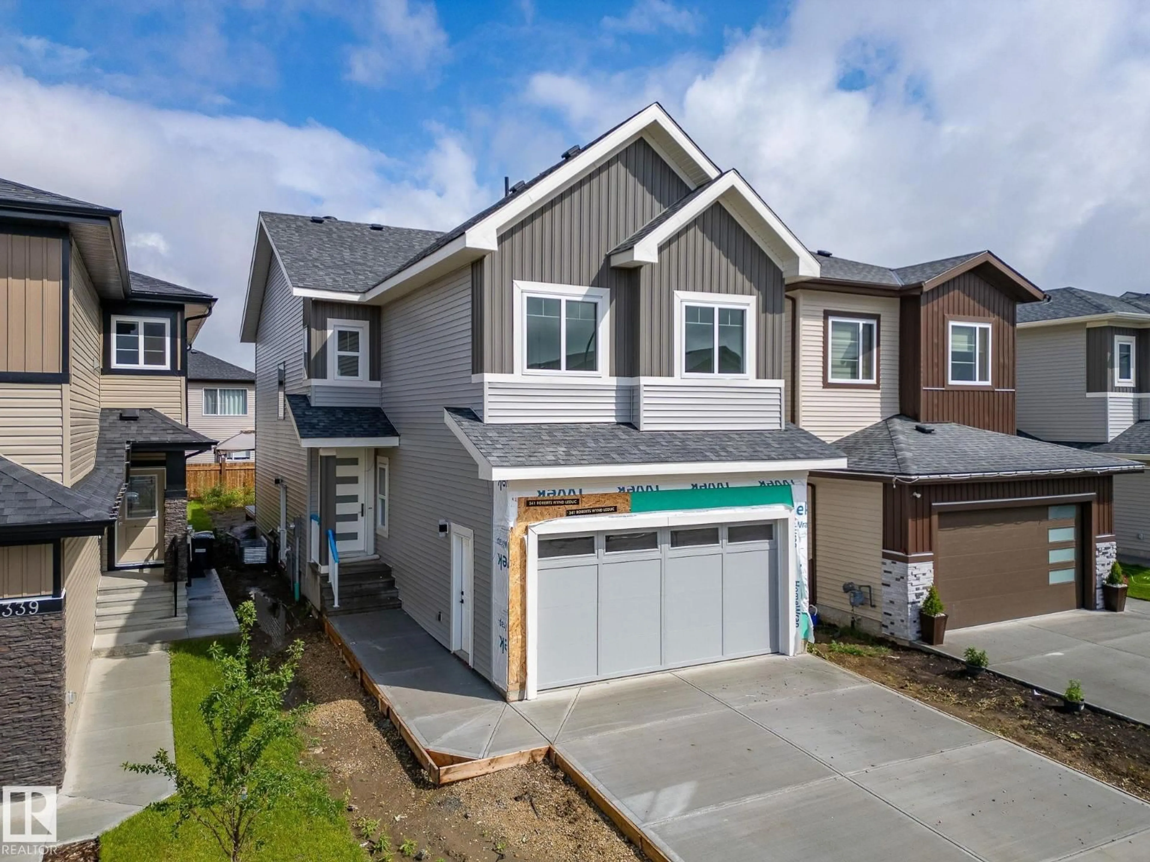 A pic from outside/outdoor area/front of a property/back of a property/a pic from drone, street for 341 ROBERTS WD, Leduc Alberta T9E1G5