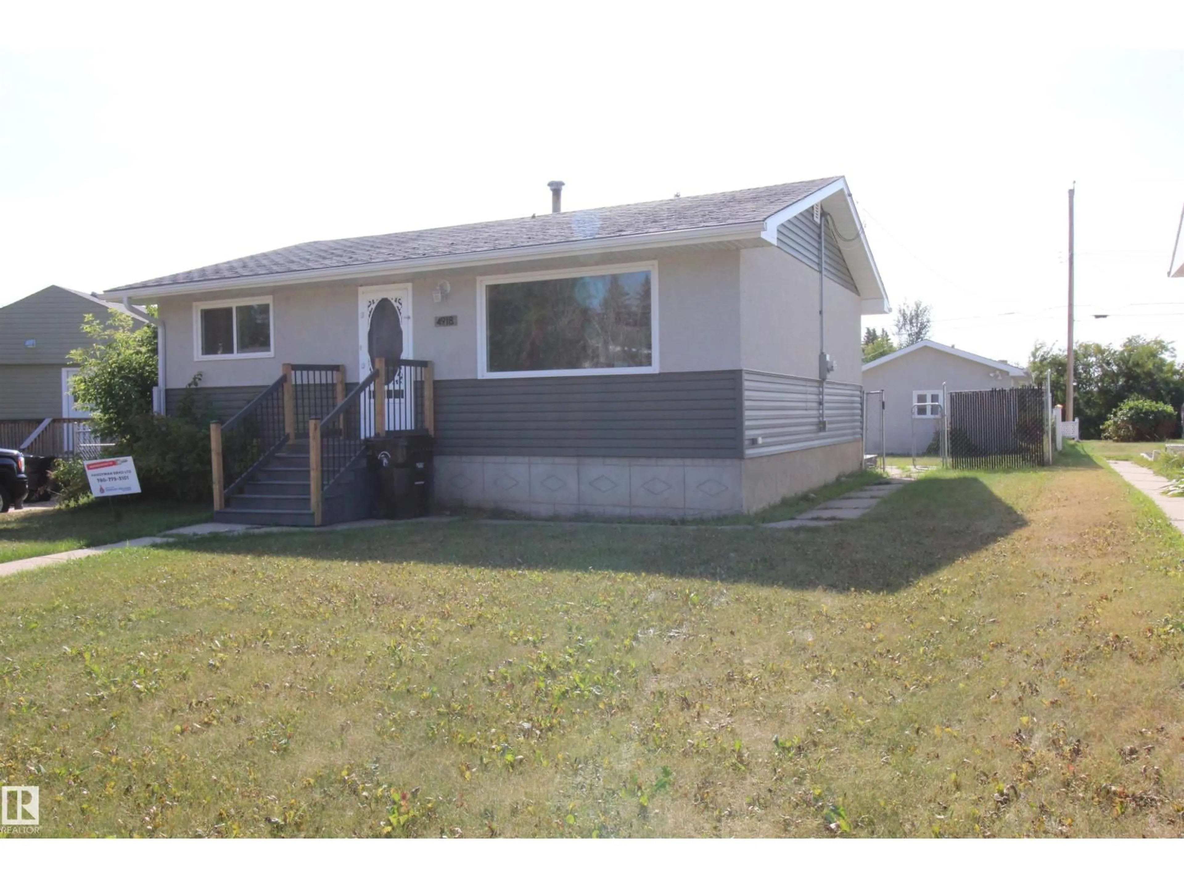 Home with vinyl exterior material, street for 4918 46A ST, Barrhead Alberta T7N1H6