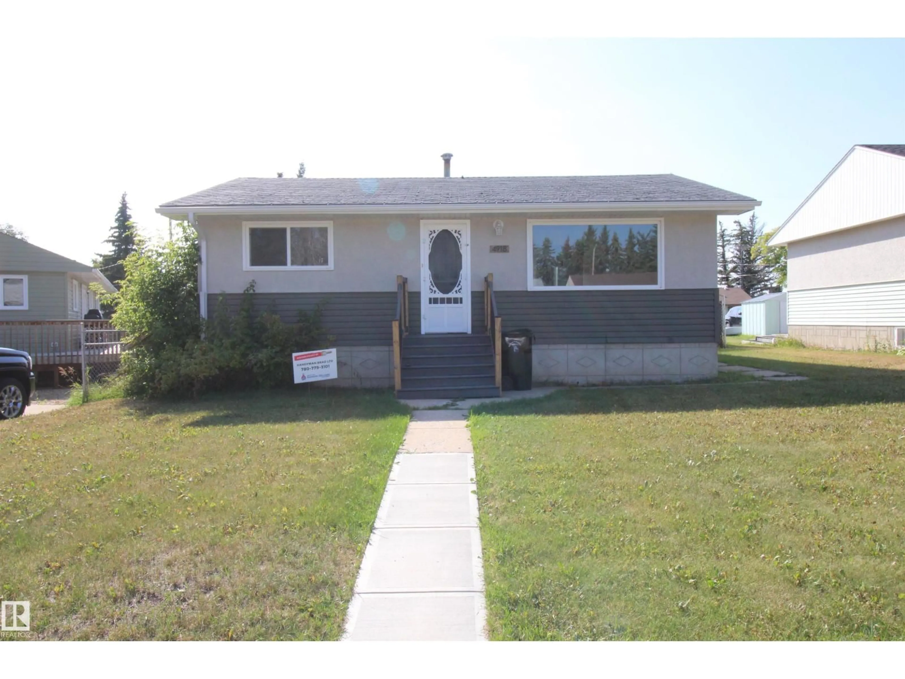Home with vinyl exterior material, street for 4918 46A ST, Barrhead Alberta T7N1H6