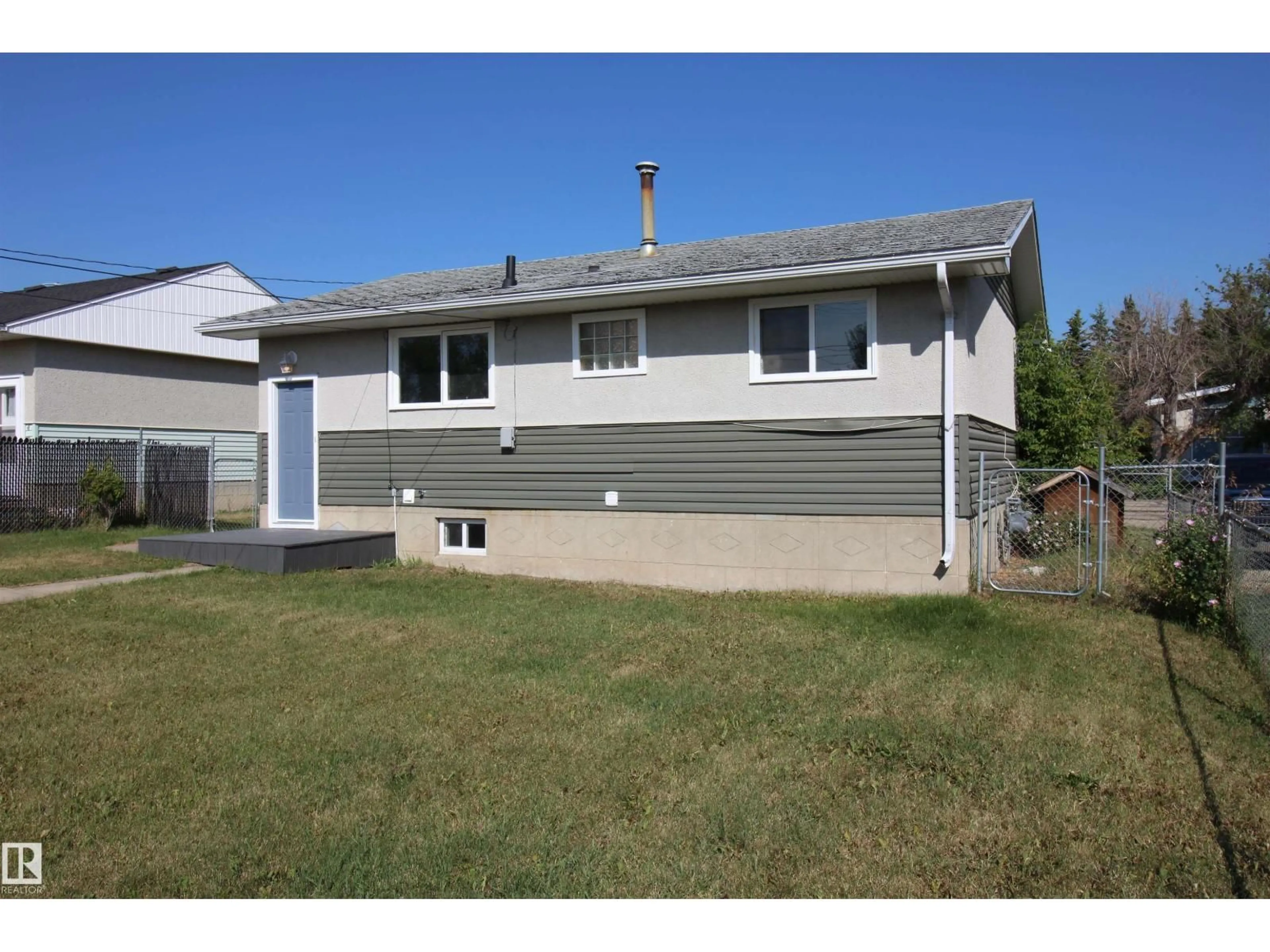 Home with vinyl exterior material, street for 4918 46A ST, Barrhead Alberta T7N1H6