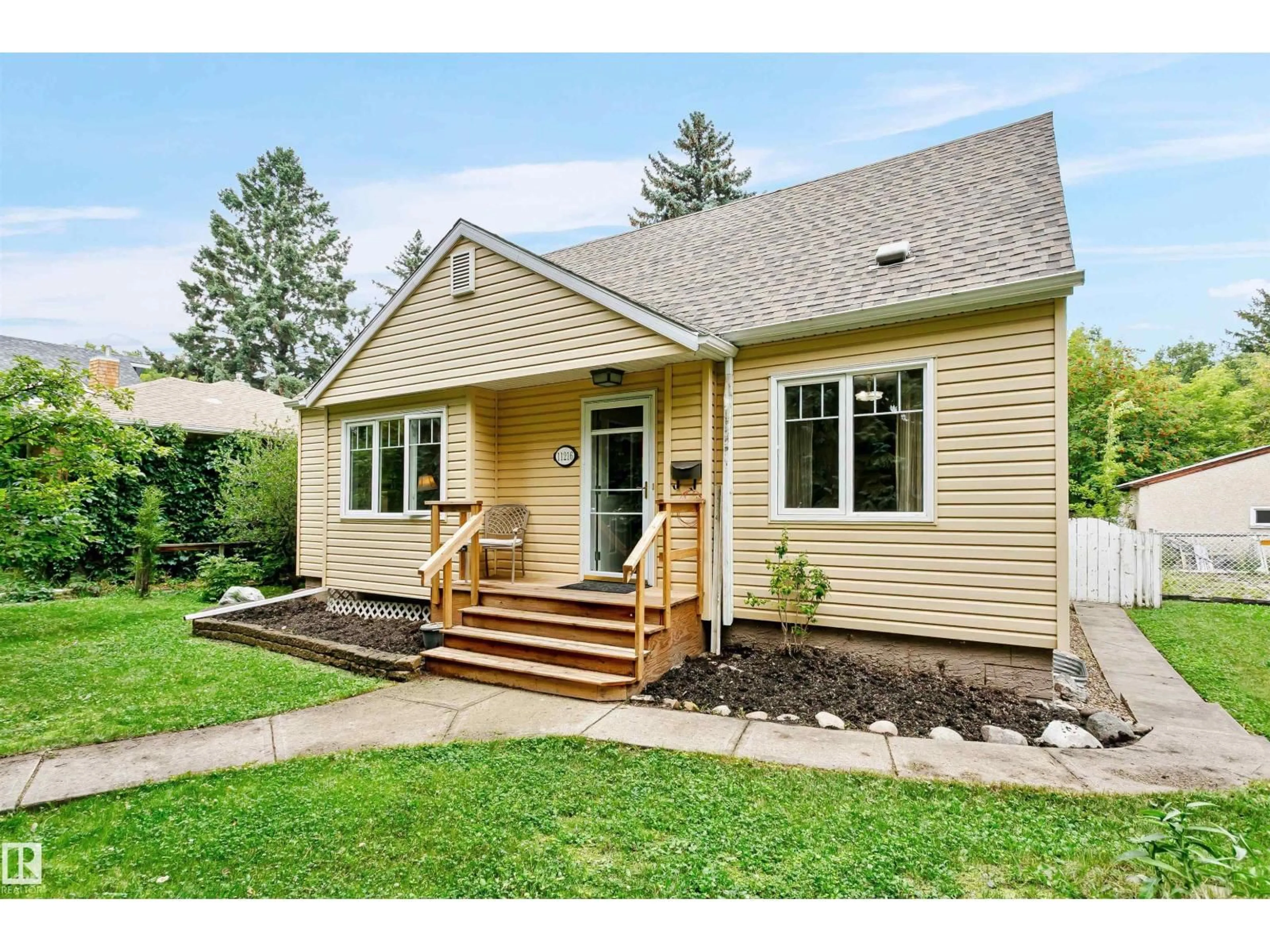 Home with vinyl exterior material, street for 11216 70 AV, Edmonton Alberta T6H2H1