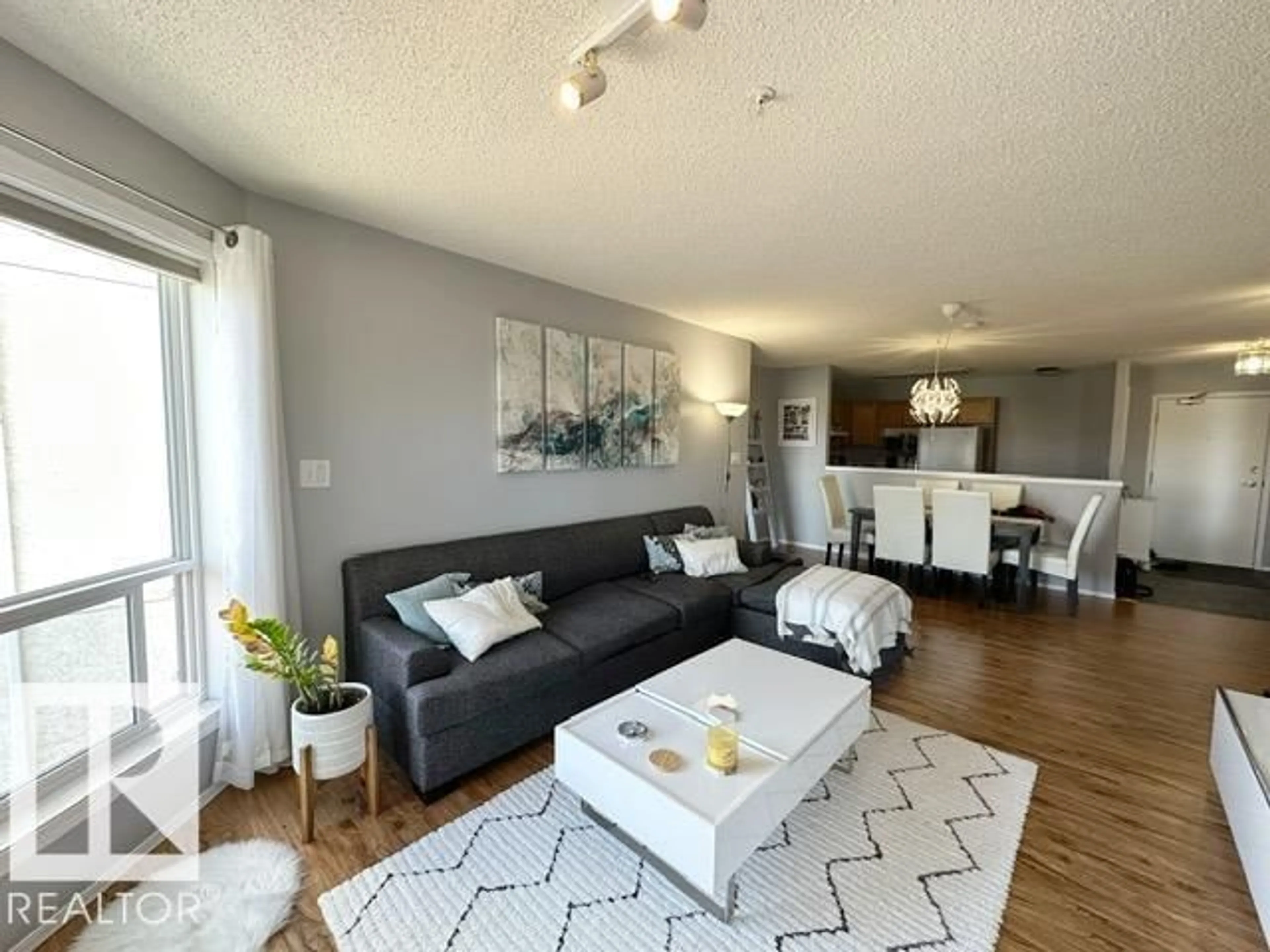 Living room with furniture, wood/laminate floor for 75 GERVAIS RD, St. Albert Alberta T8N6N2