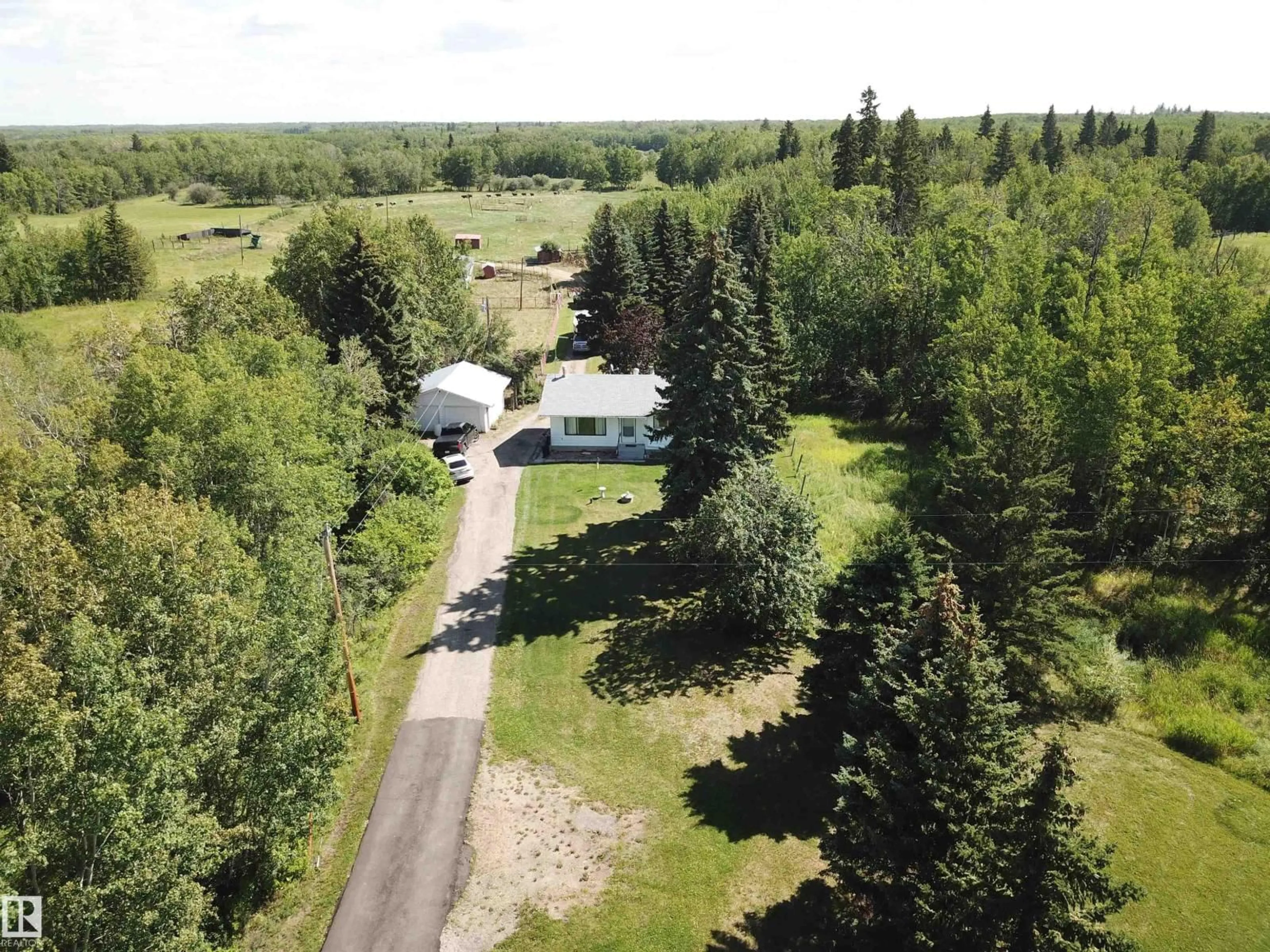 A pic from outside/outdoor area/front of a property/back of a property/a pic from drone, forest/trees view for 53121 RG RD 212, Rural Strathcona County Alberta T8G1G1