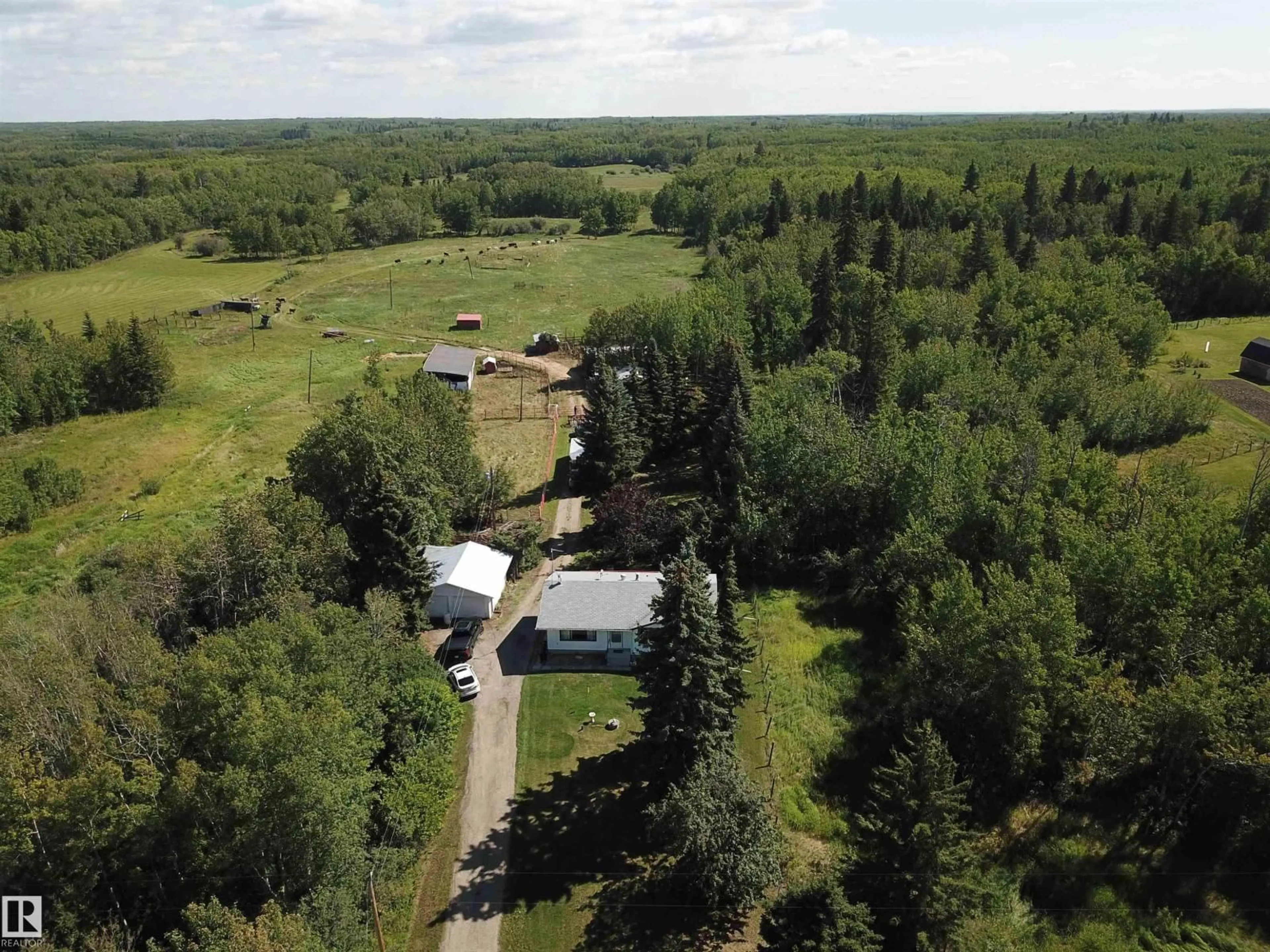 A pic from outside/outdoor area/front of a property/back of a property/a pic from drone, forest/trees view for 53121 RG RD 212, Rural Strathcona County Alberta T8G1G1