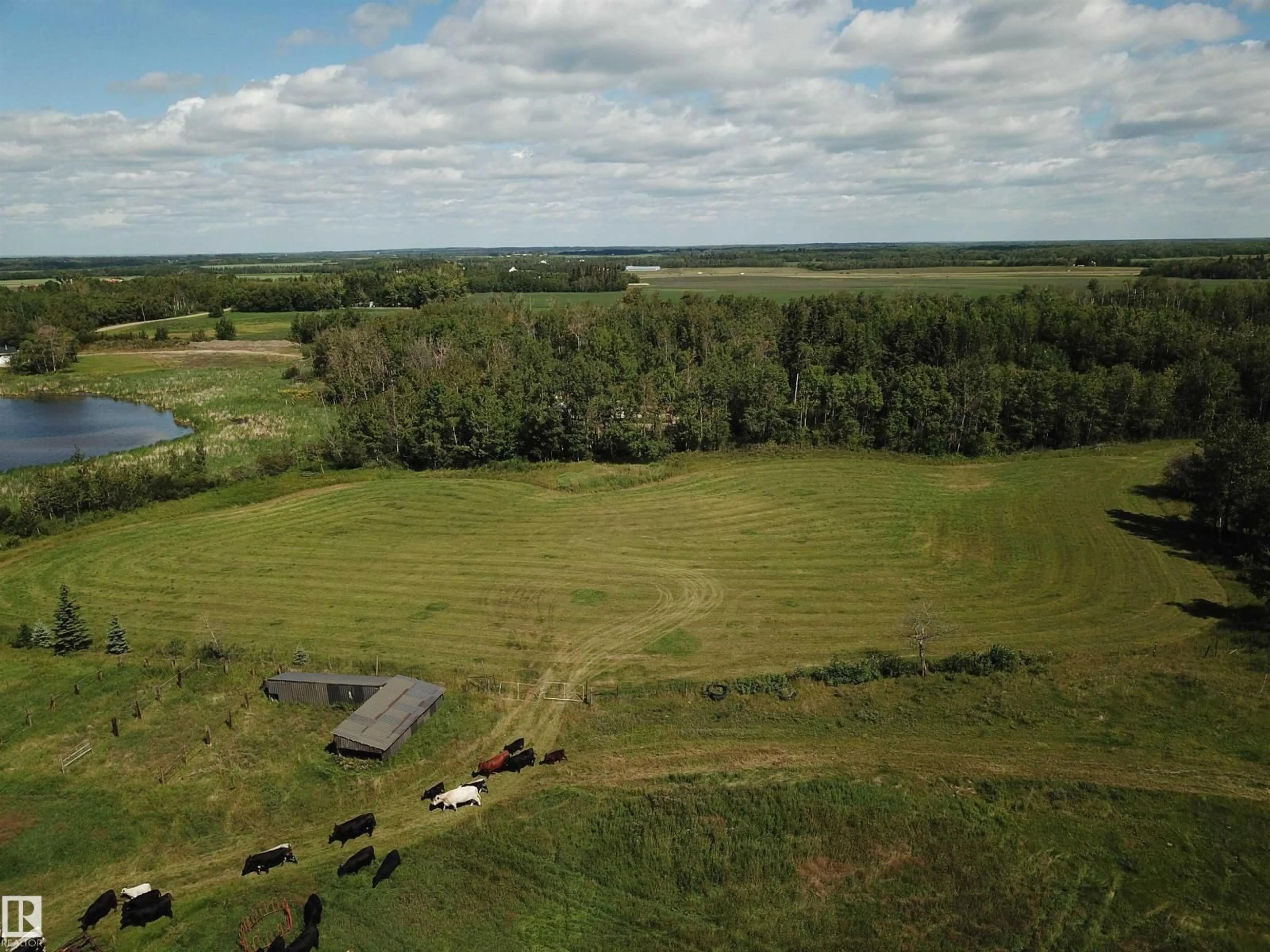A pic from outside/outdoor area/front of a property/back of a property/a pic from drone, water/lake/river/ocean view for 53121 RG RD 212, Rural Strathcona County Alberta T8G1G1