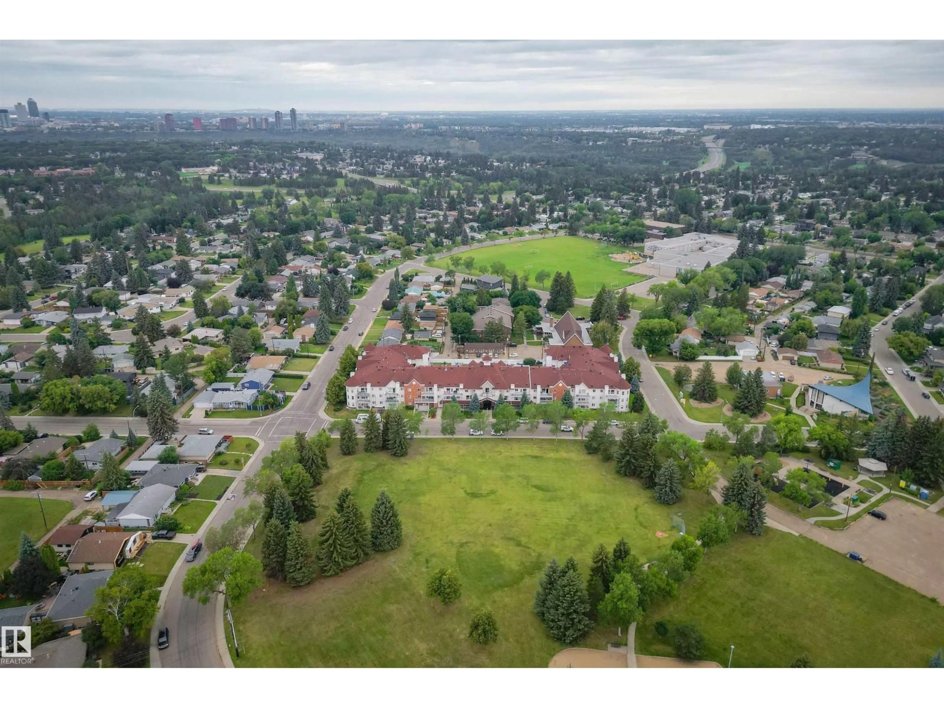 A pic from outside/outdoor area/front of a property/back of a property/a pic from drone, mountain view for #304 - 6220 FULTON RD, Edmonton Alberta T6A3T4