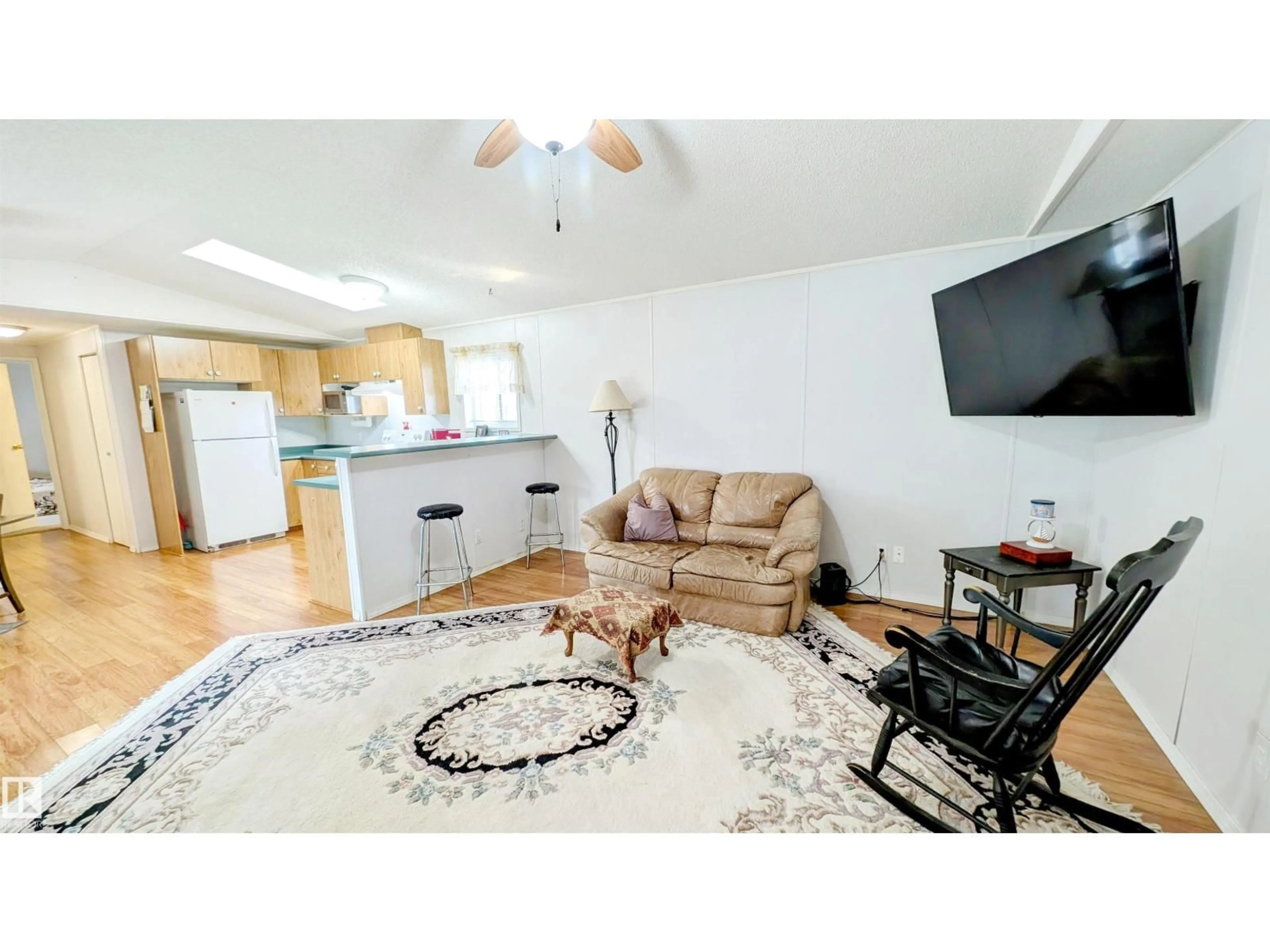 Living room with furniture, wood/laminate floor for 1540 JUBILEE WD, Sherwood Park Alberta T8H1V2