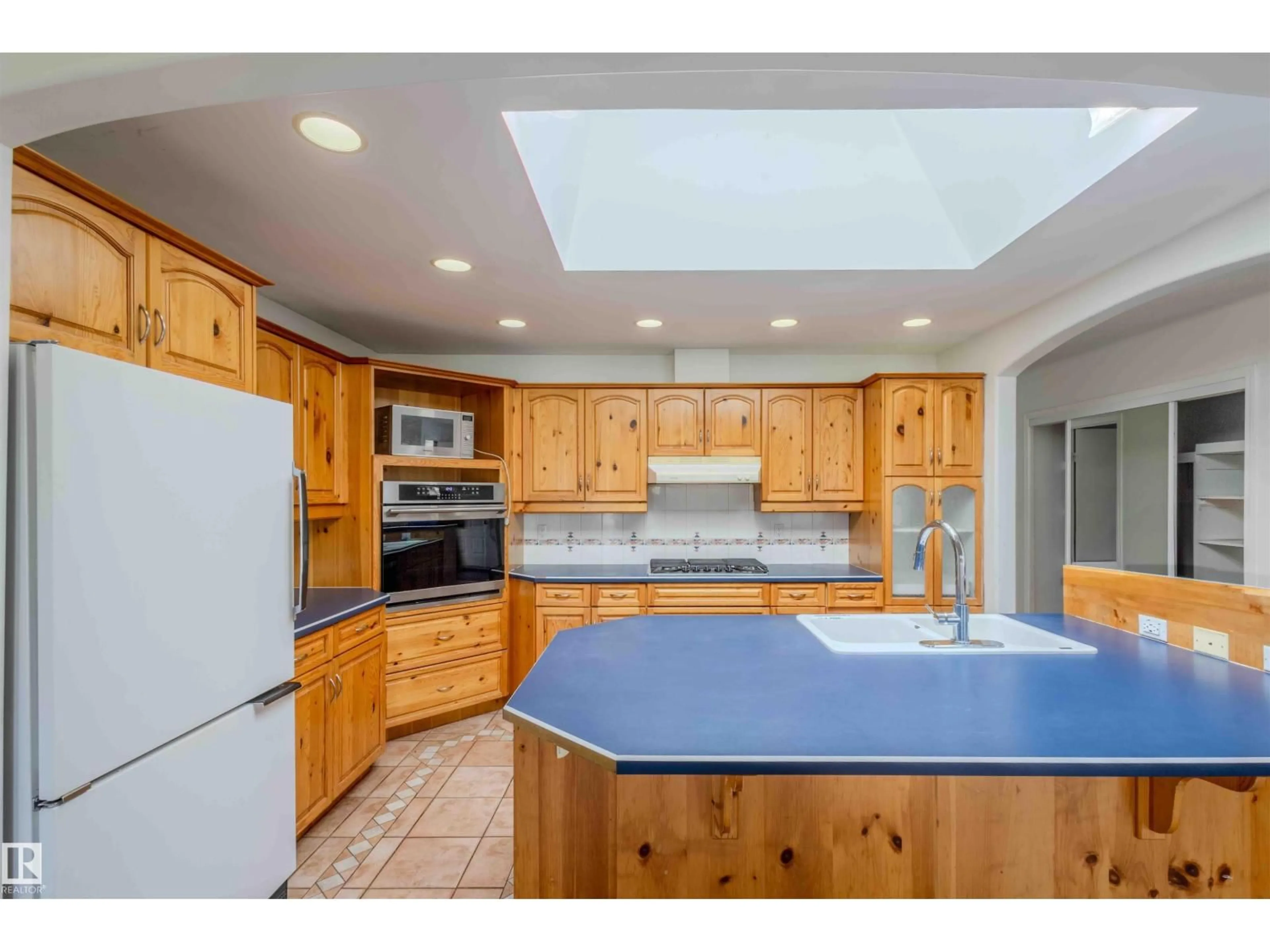 Open concept kitchen, ceramic/tile floor for 6007 10 AV, Edmonton Alberta T6L3A5