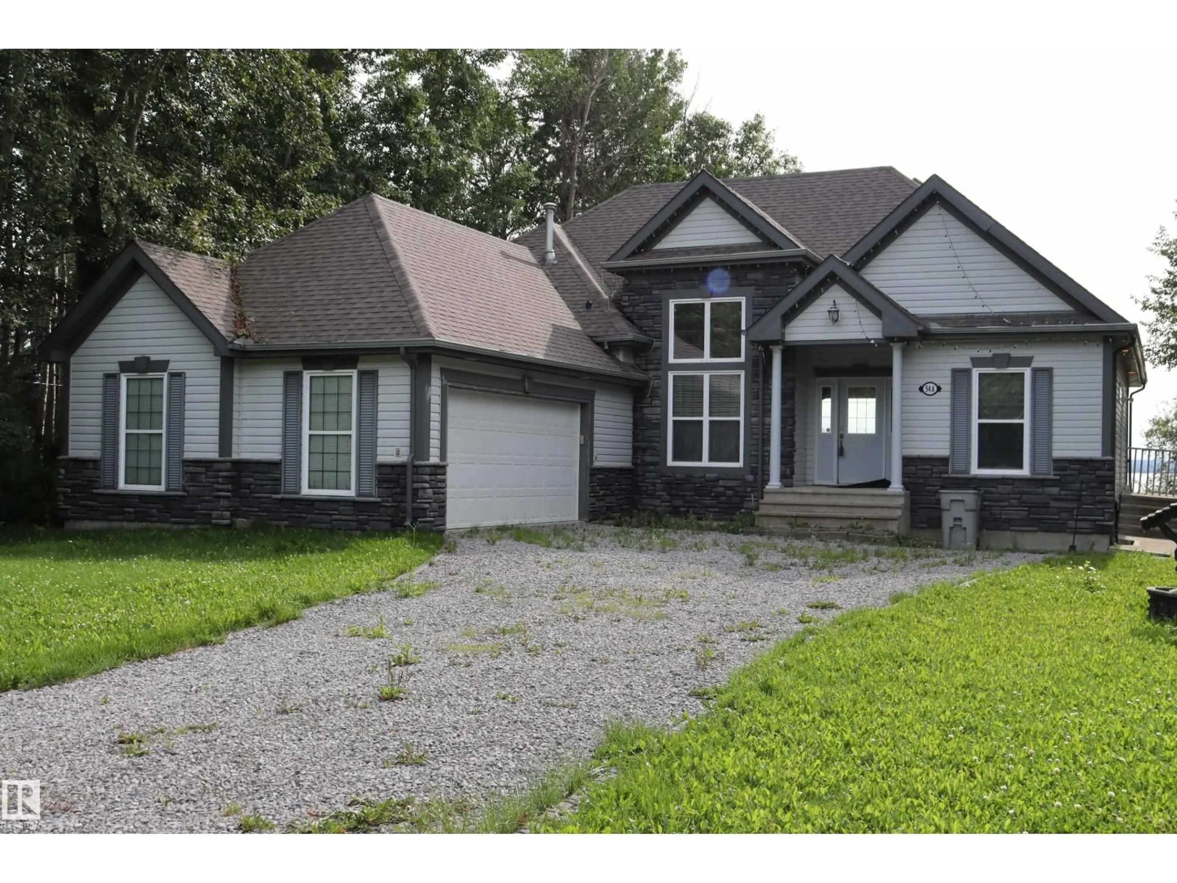 Home with vinyl exterior material, street for A54 JOHNSONIA, Rural Leduc County Alberta T0C2C0