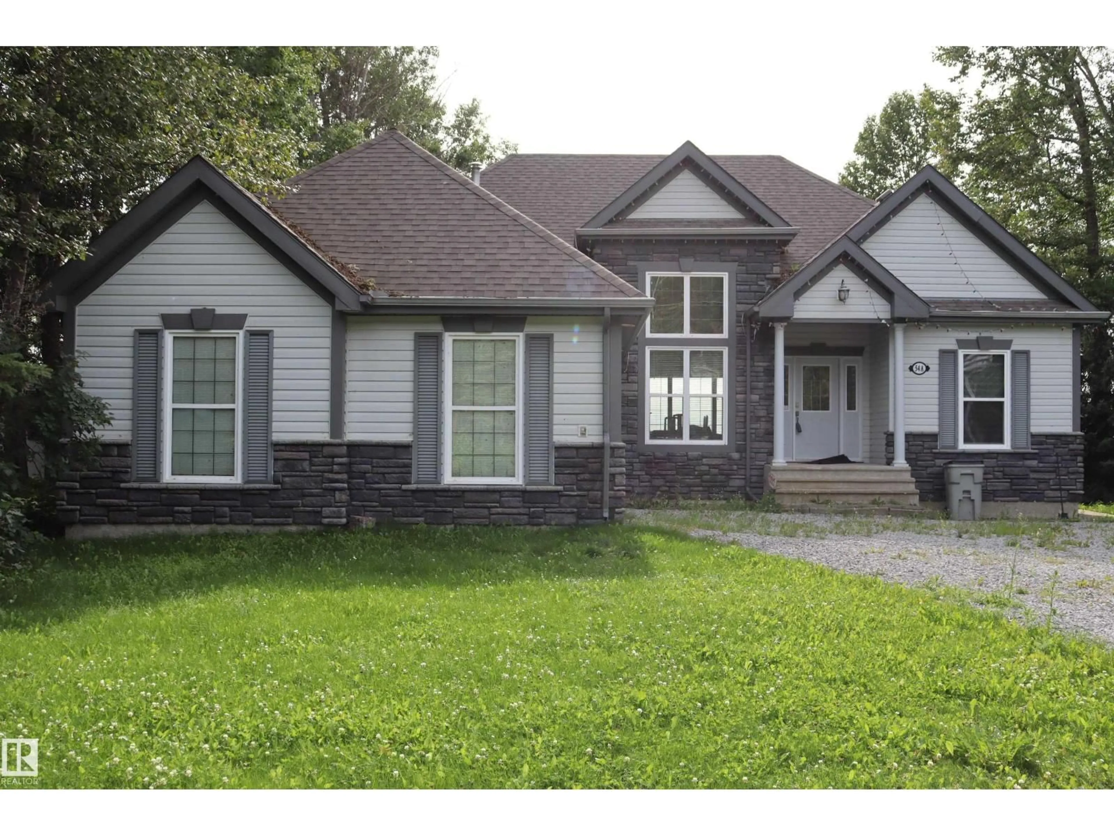 Home with brick exterior material, street for A54 JOHNSONIA, Rural Leduc County Alberta T0C2C0