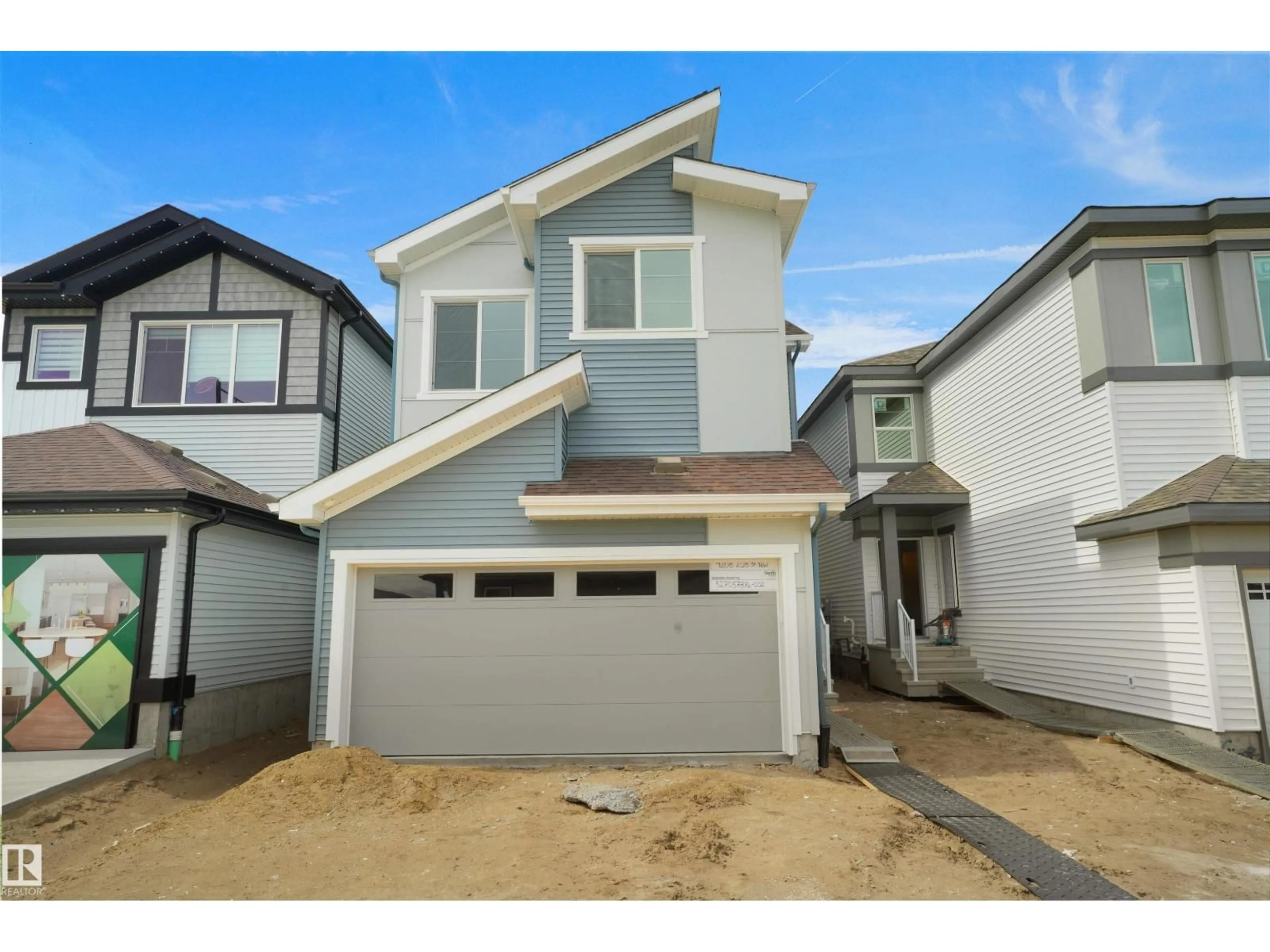 Home with vinyl exterior material, street for 4208 208 ST NW, Edmonton Alberta T6M3E4