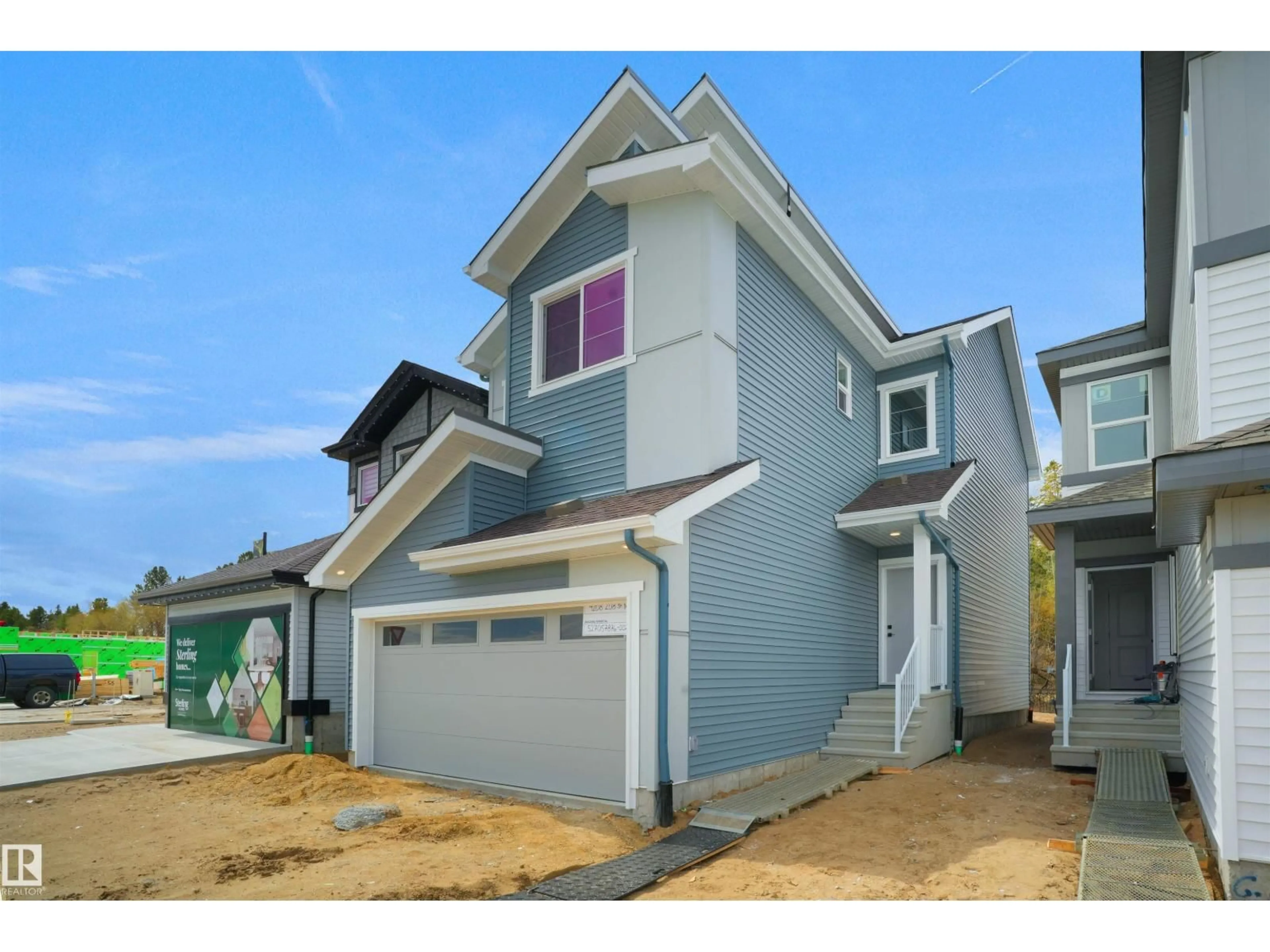 Home with vinyl exterior material, street for 4208 208 ST NW, Edmonton Alberta T6M3E4