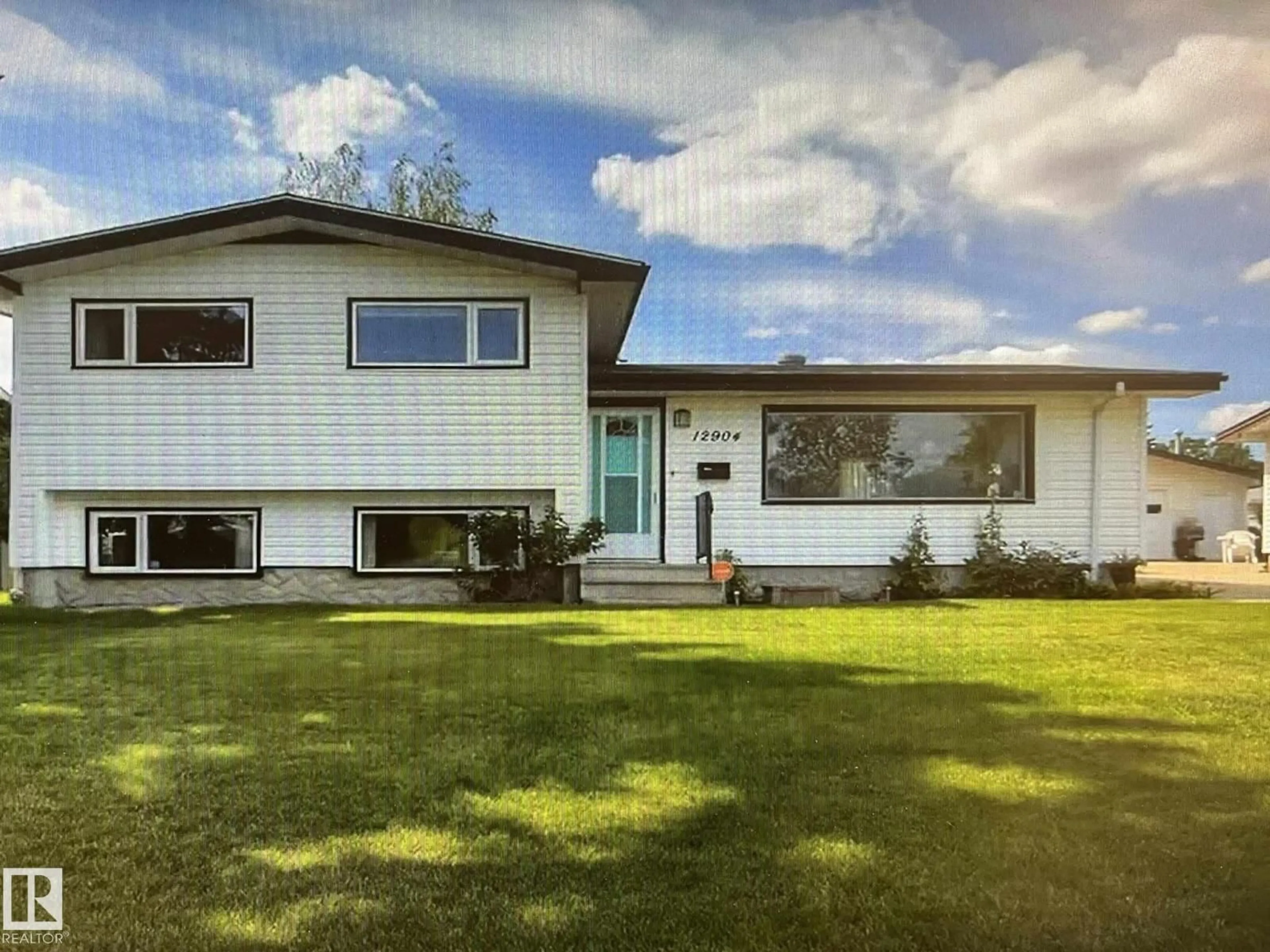 Home with vinyl exterior material, street for NW - 12904 95 ST, Edmonton Alberta T5E3Y1