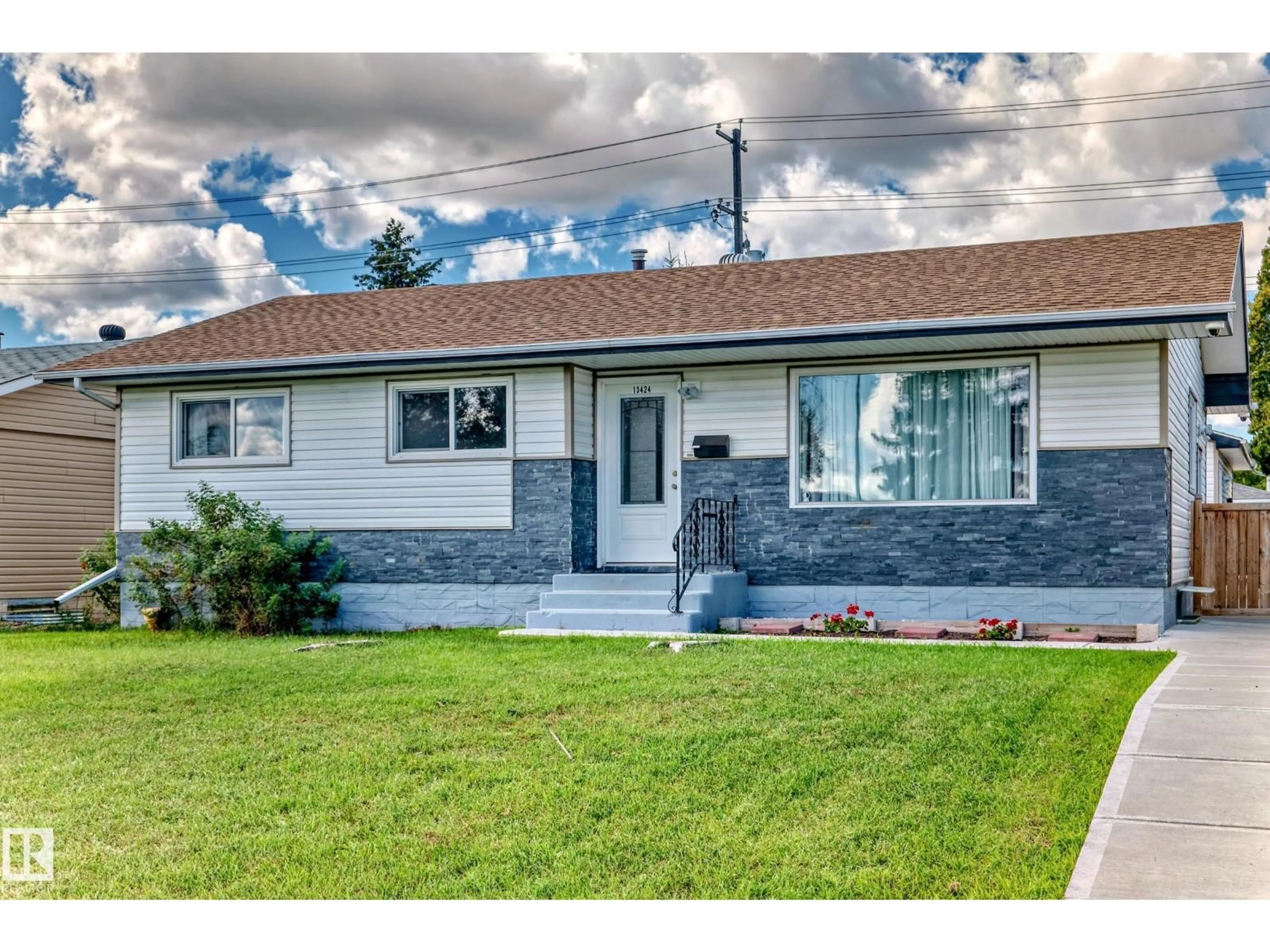 Home with vinyl exterior material, street for 13424 82 ST, Edmonton Alberta T5E2V2