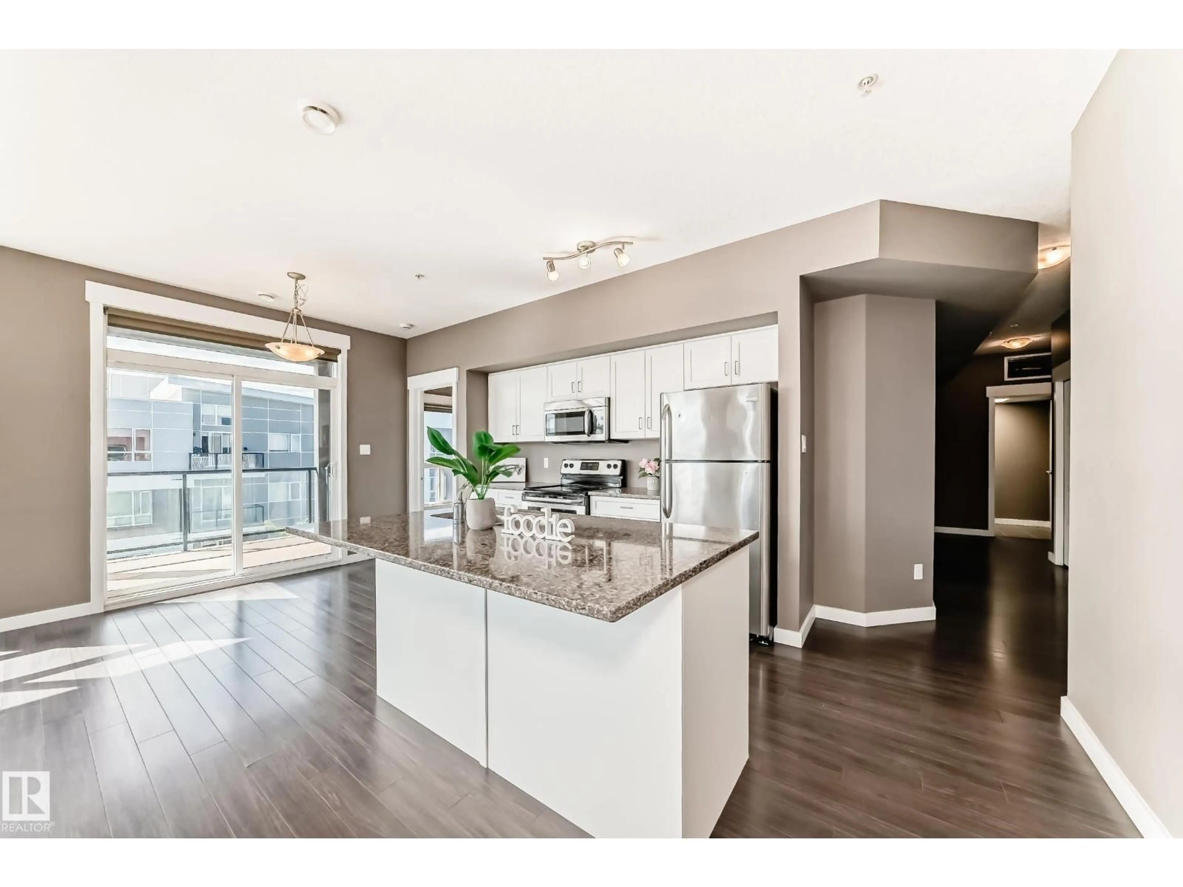 Open concept kitchen, wood/laminate floor for #504 - 10518 113 ST, Edmonton Alberta T5H0C6