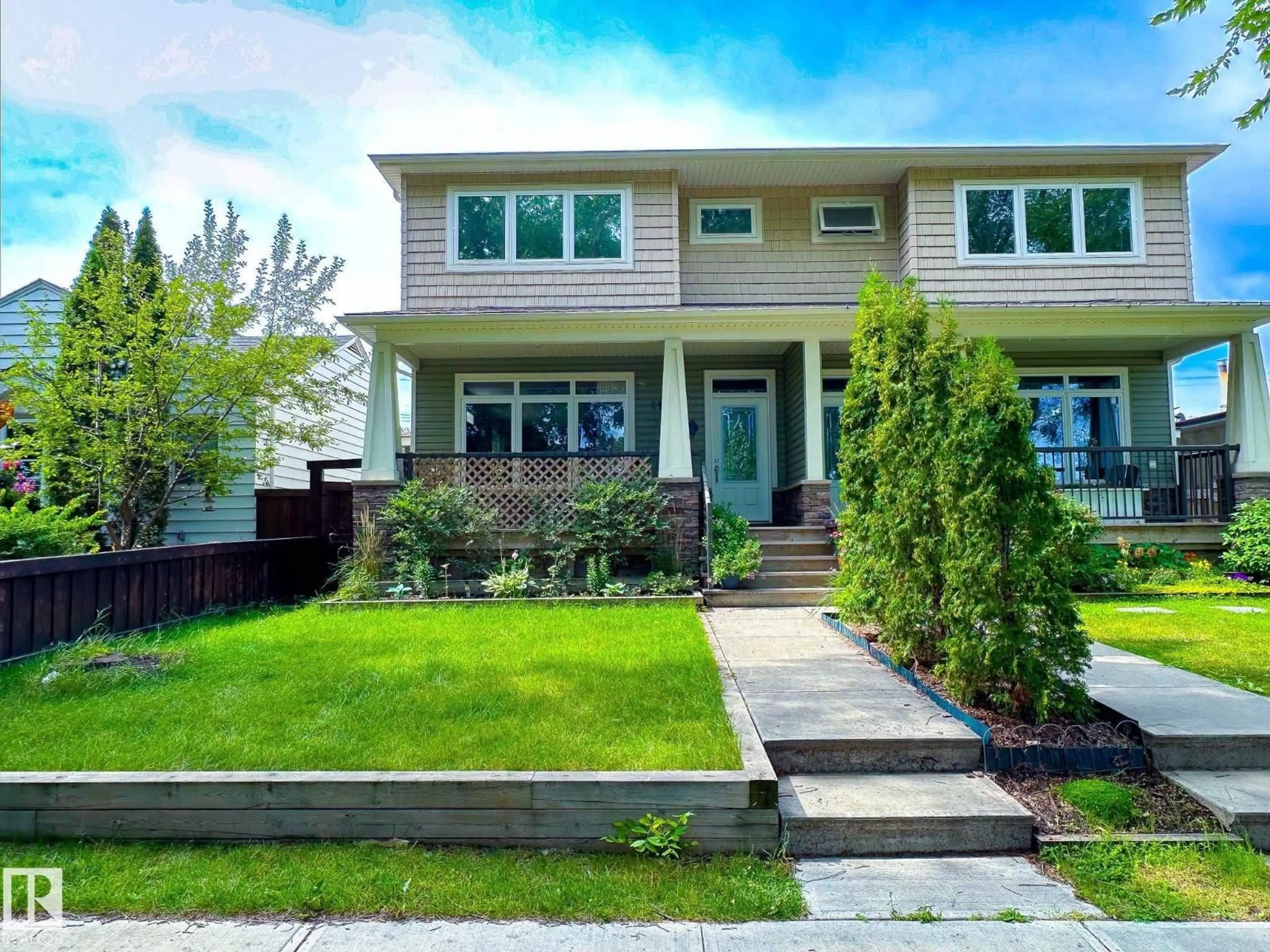 Home with vinyl exterior material, street for 11734 129 ST NW, Edmonton Alberta T5M0Y7