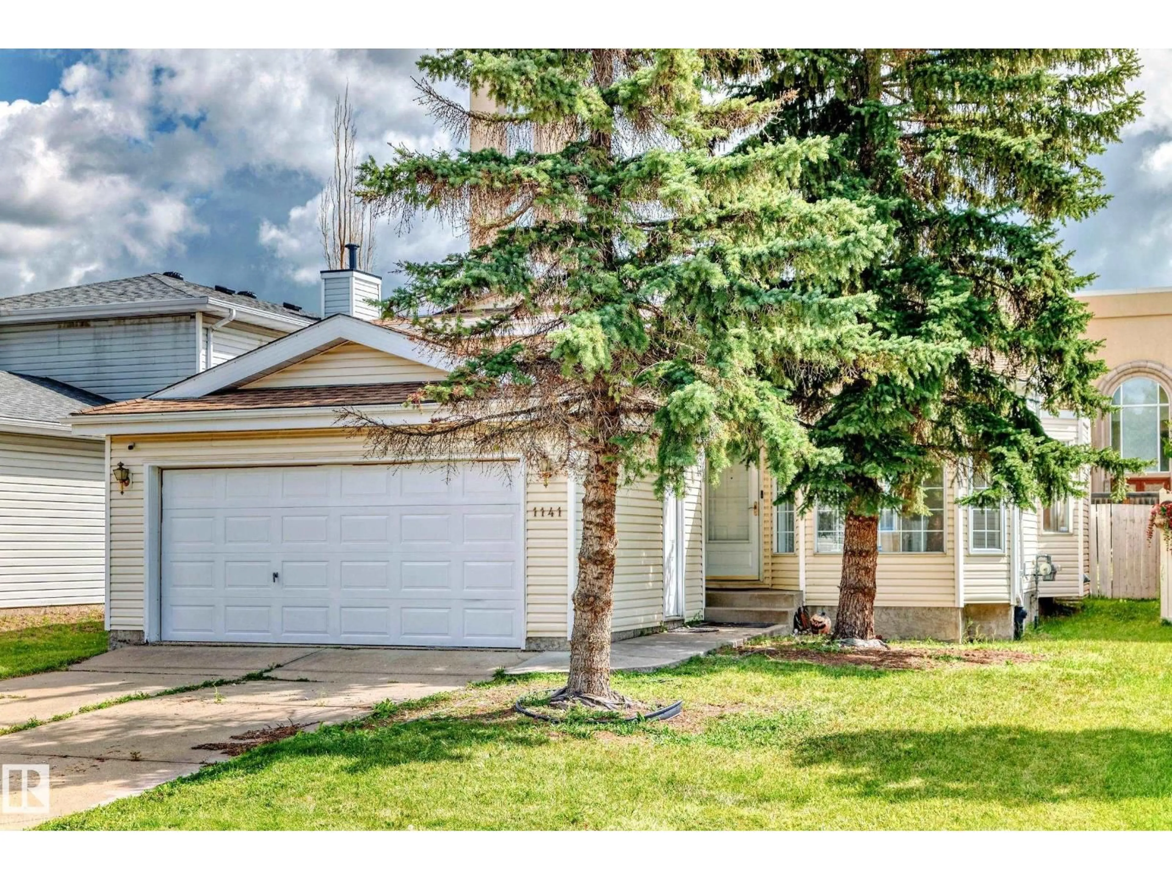 Home with vinyl exterior material, street for 1141 60 ST, Edmonton Alberta T6L6R4