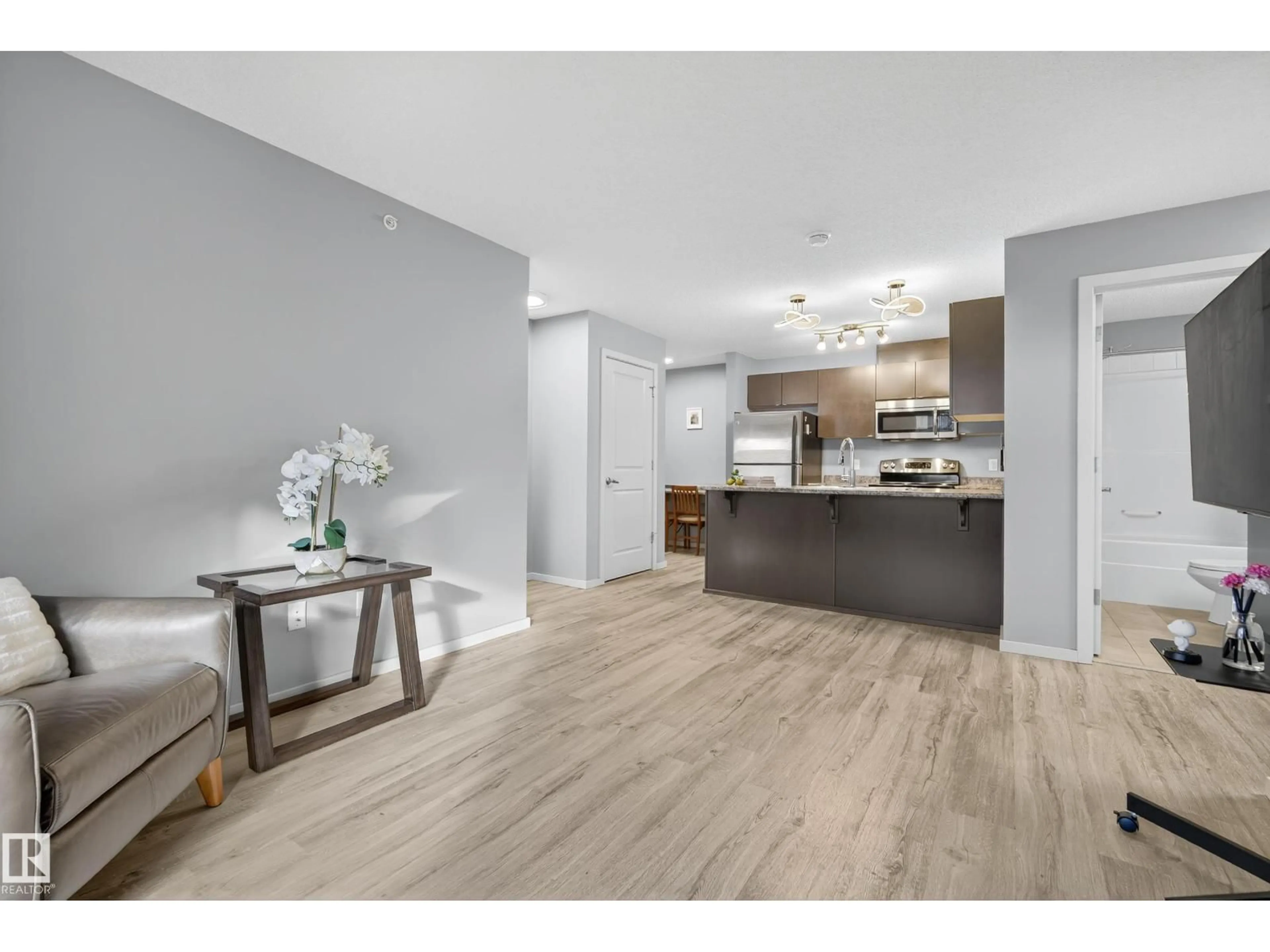 Open concept kitchen, wood/laminate floor for #409 - 340 WINDERMERE RD, Edmonton Alberta T6W2P2