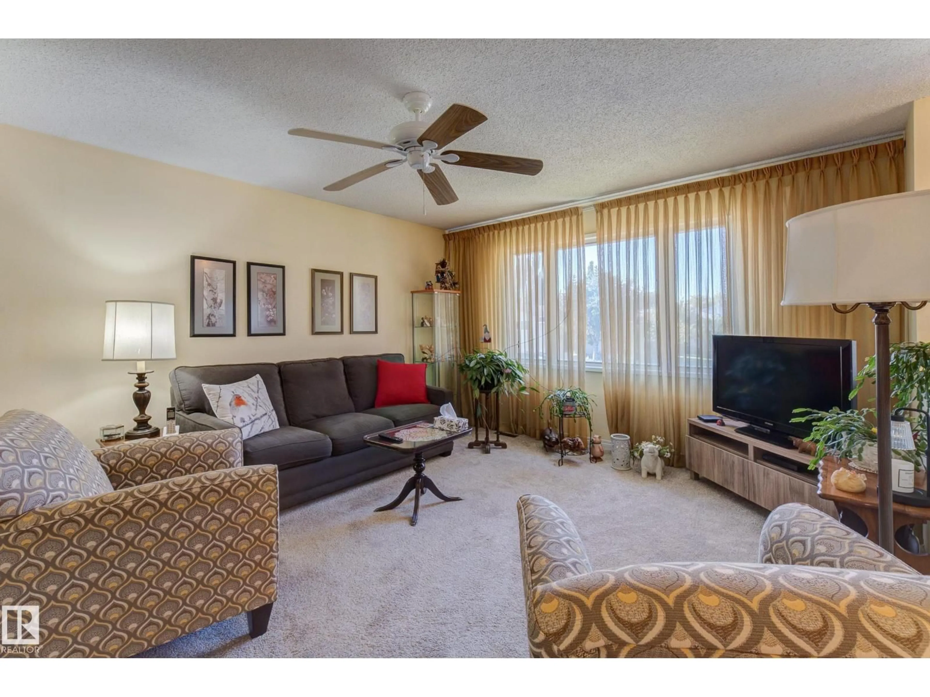 Living room with furniture, carpet floor for 6228 13 AV, Edmonton Alberta T6L2E6
